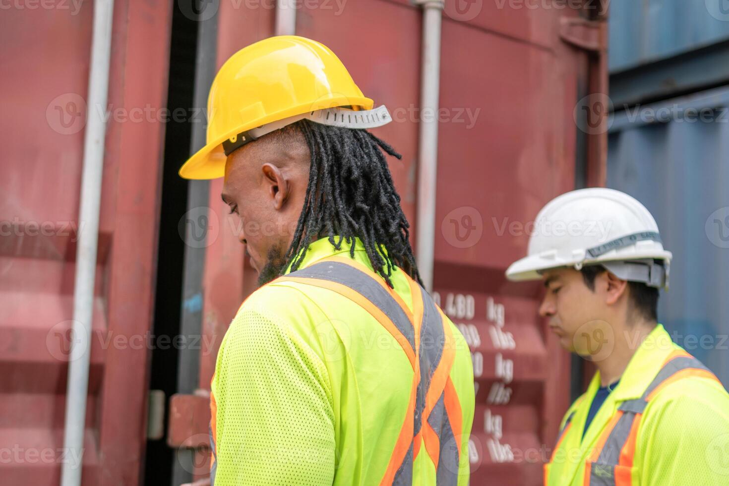 Workers inspecting containers box at shipping container cargo, Engineer and foreman team in industry containers yard photo