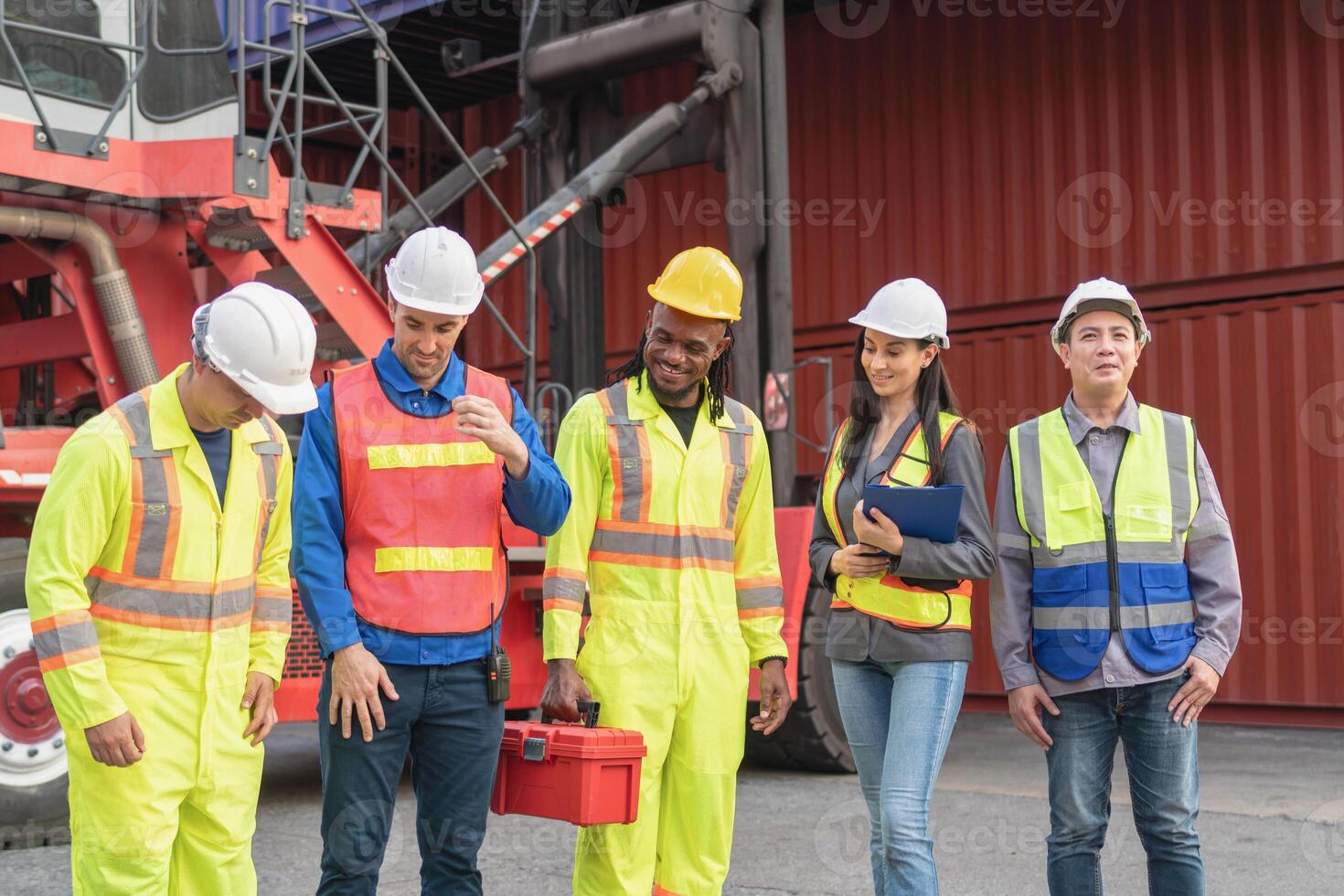 Relaxing engineer and foreman worker team in industry containers yard, Diverse team of workers at shipping container cargo photo