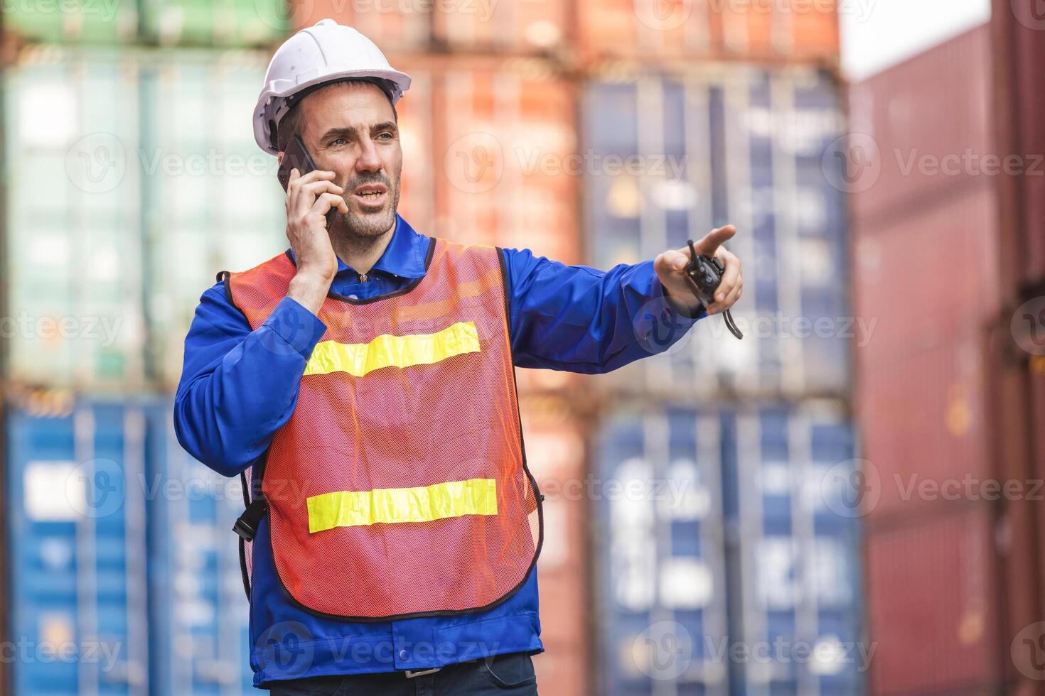 Engineer man checking containers box in industry containers yard, Foreman dock worker inspecting containers box photo