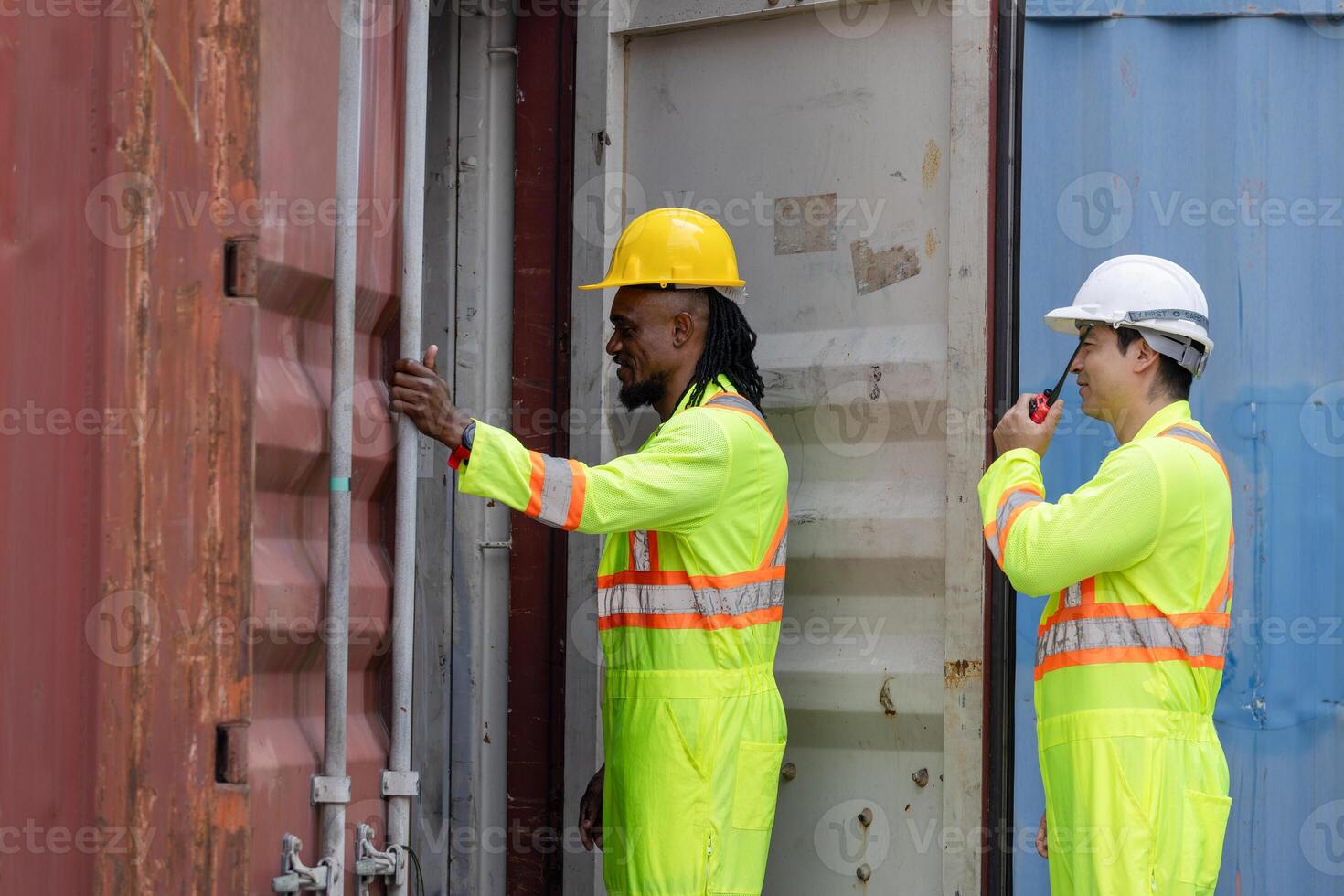 Dock workers man team inspecting containers box at shipping container cargo, Engineer and foreman working in industry containers yard photo
