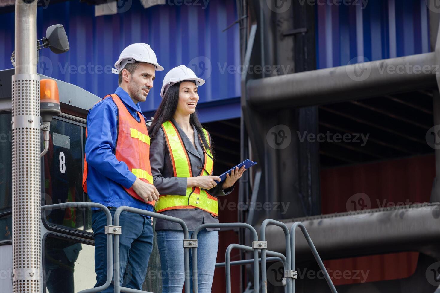 Engineers Team on Loaded Container Handler Control Loading Containers Box at at Shipping Yard, Foreman Workers Inspecting at Shipping Yard photo