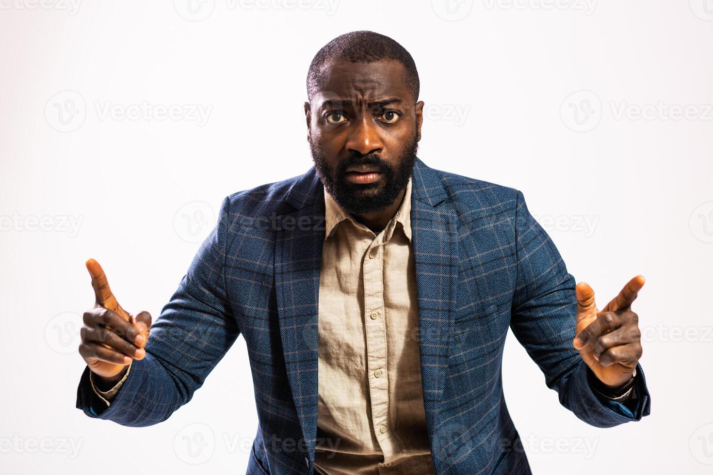 Studio shot of African American professional in business attire expressing displeasure and concern, representing themes of mobbing or toxic workplace dynamics. photo