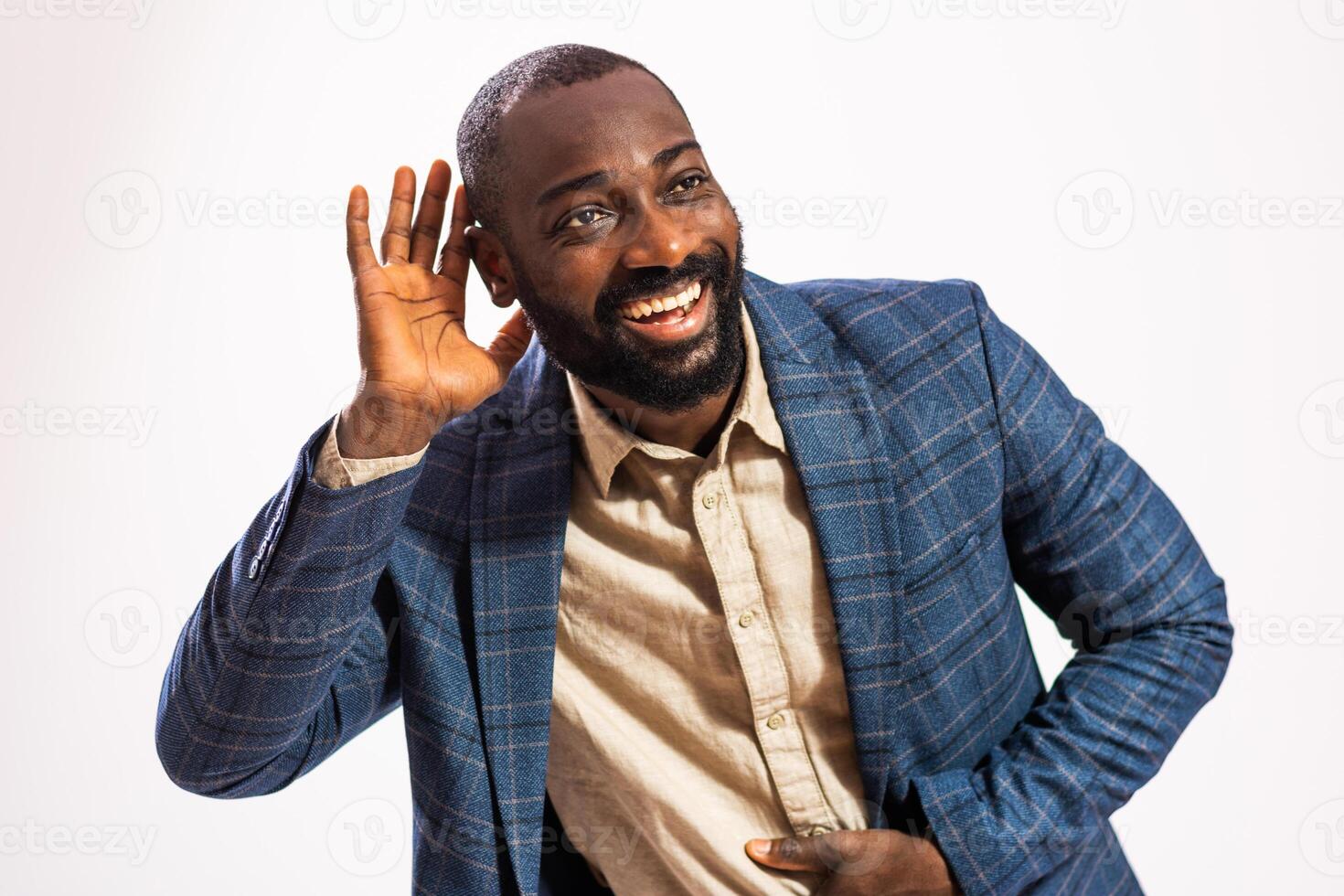 Studio shot portrait of happy and businessman who is eavesdropping. photo