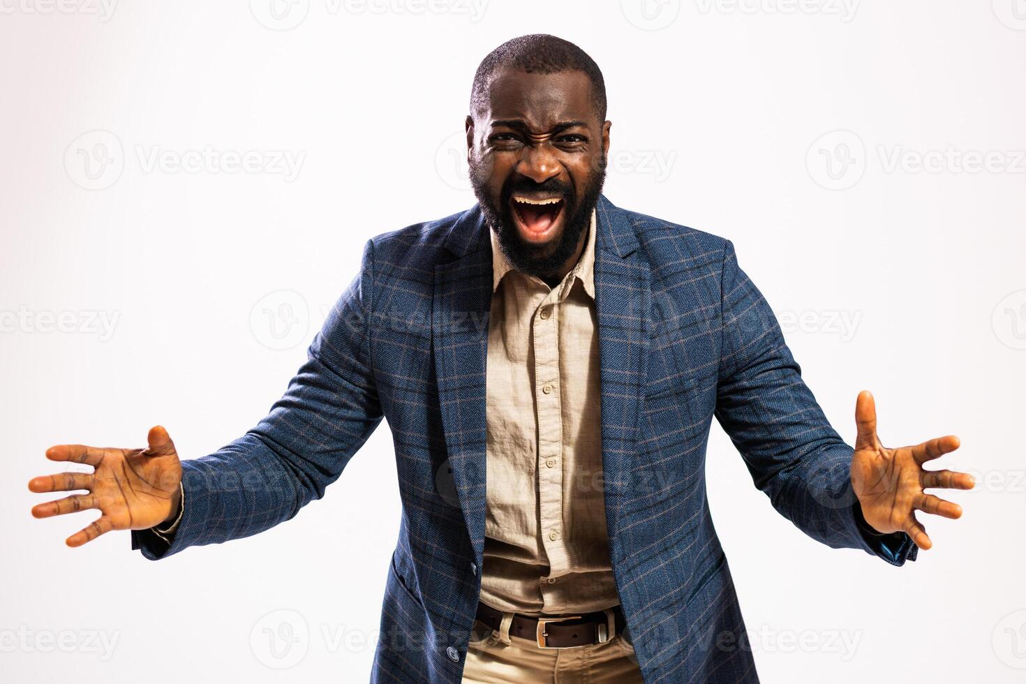 Studio shot of distraught African American yelling in anger while dealing with business stress. photo