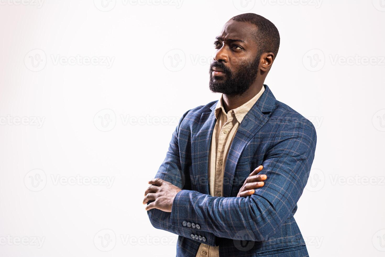 Serious African American boss looking away thoughtfully, reflecting on business strategies and challenges. photo