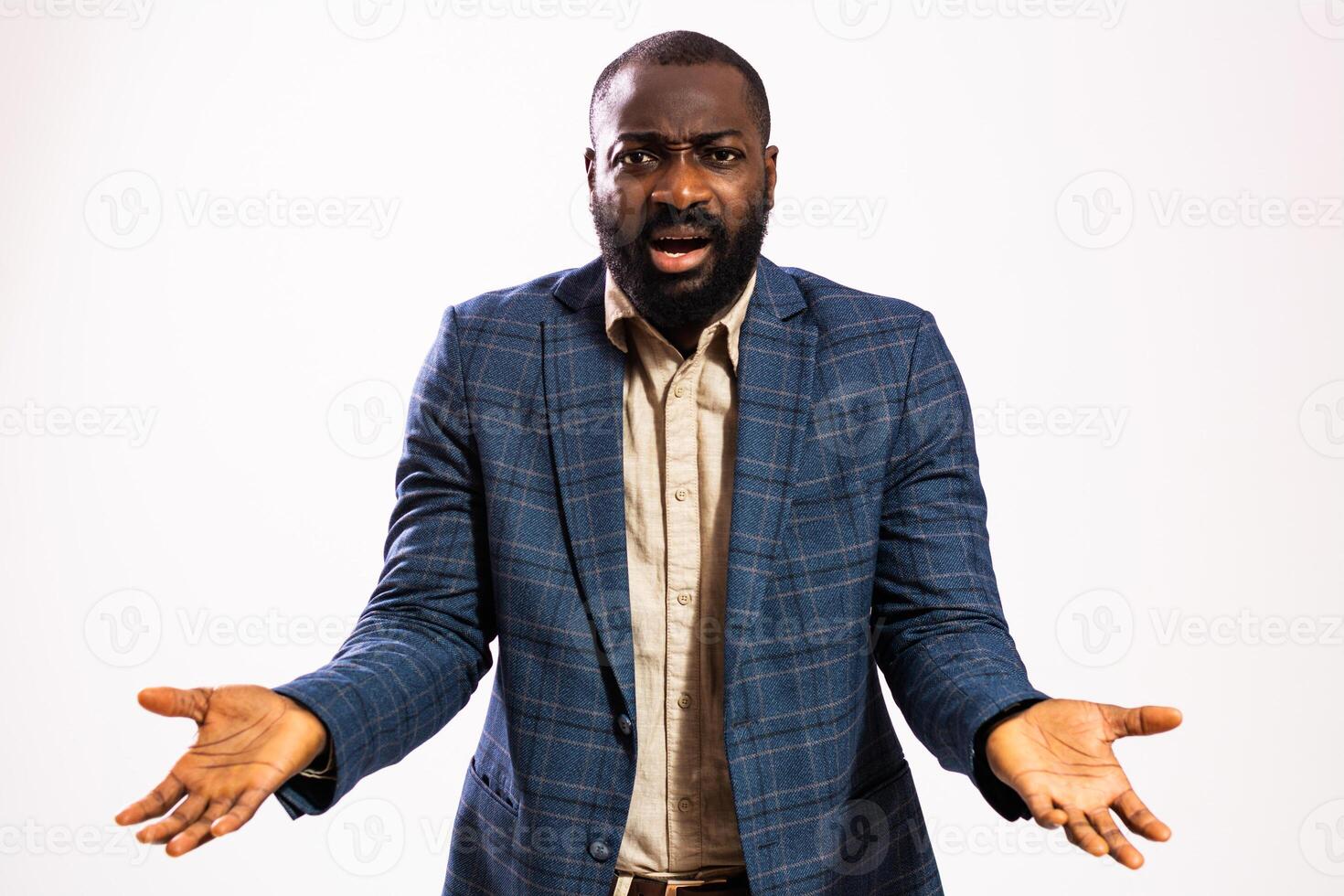Shocked businessman with wide eyes and open mouth, reacting to unexpected news, isolated on gray background. photo