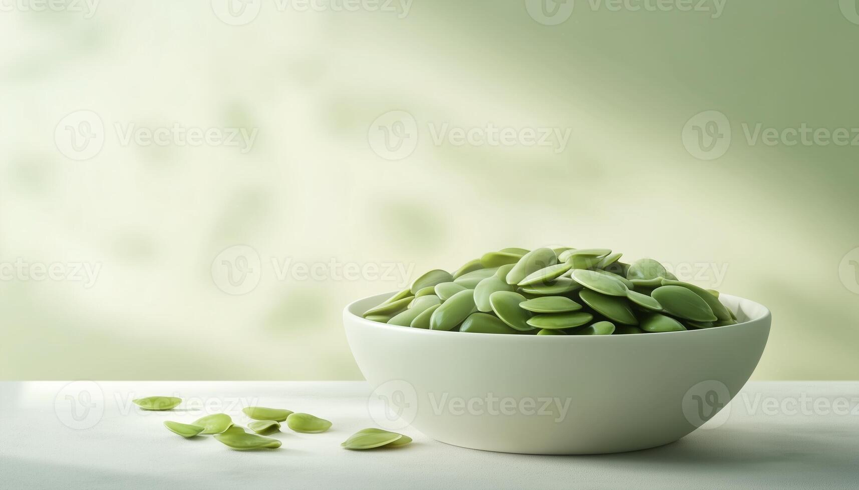 Organic green pumpkin seed on white ceramic bowl with light shadow photo