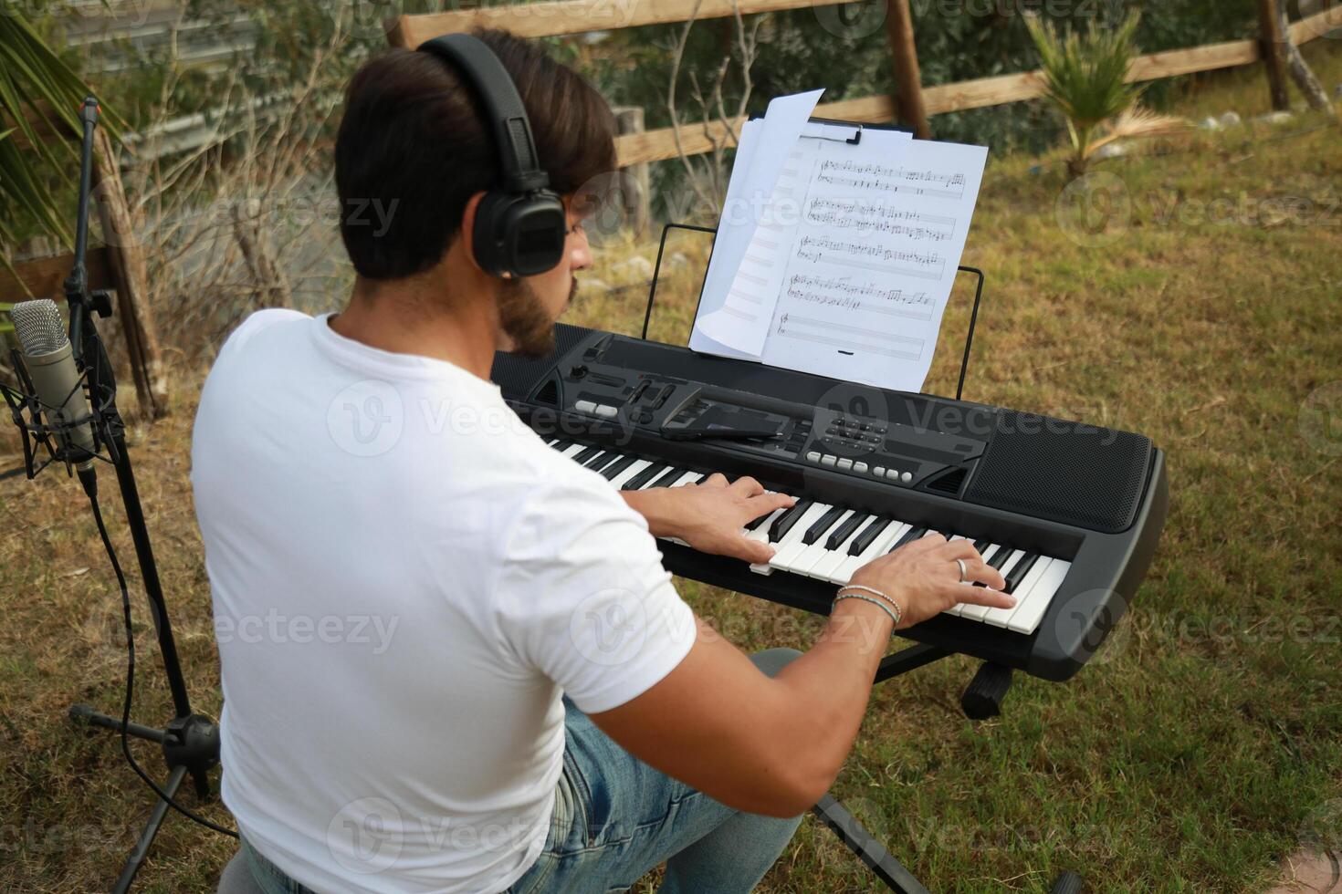 Boy Pianist Plays Keyboard In An Outdoor Garden For A Private Party Outdoor photo