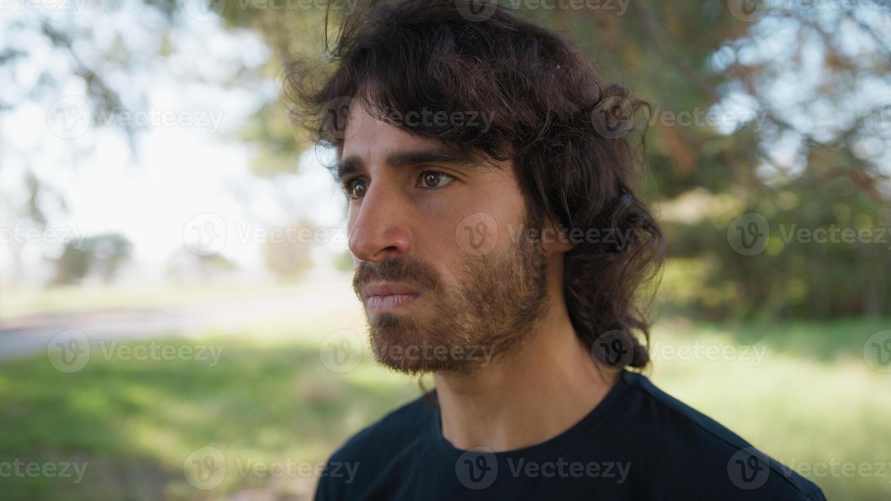 Angry Long Hair Man Thinks About Mistakes Made and Gets Nervous in Nature Outdoor photo