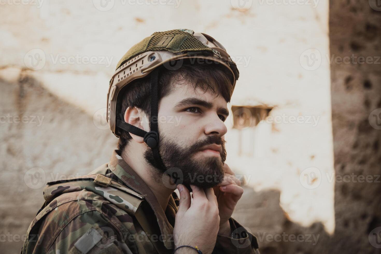 Soldier Puts On His Hat Before Scouting The Dangerous Area photo