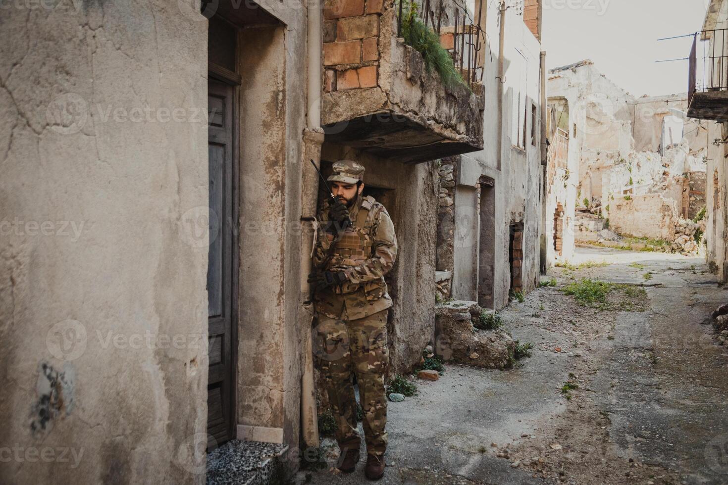 Soldier Communicates With Walkie Talkie Before Raiding A House photo