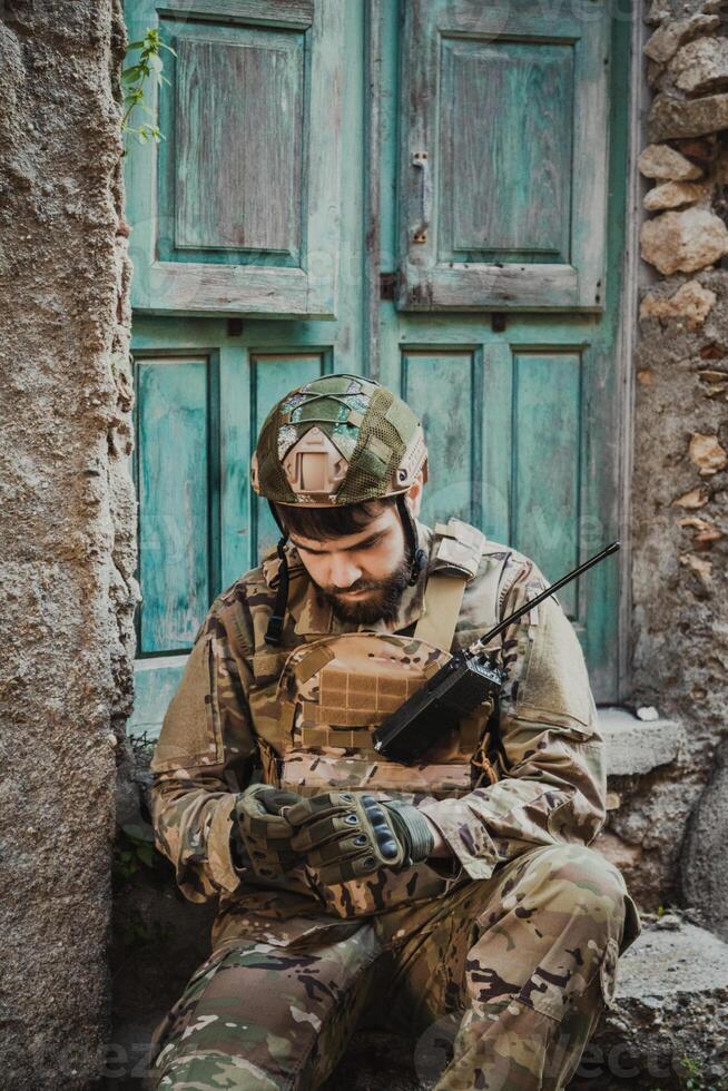 Young Soldier In War Opens The Compass To Understand Where He Is photo