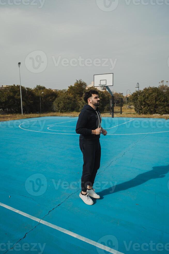 Basketball Player Jogs in Place to Get Ready for the Game photo