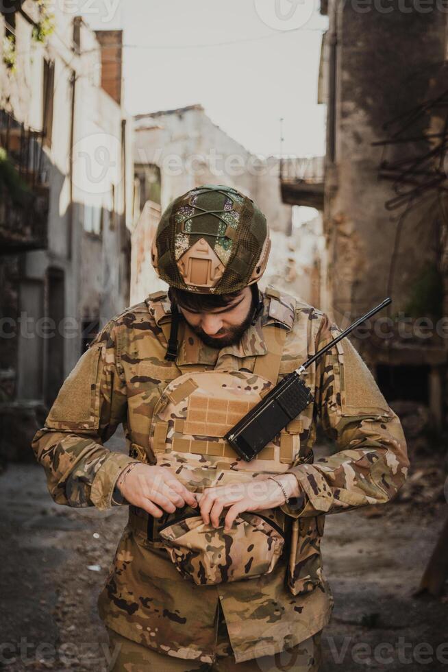 Soldier Puts On Gloves Before Starting The Operation In The City photo