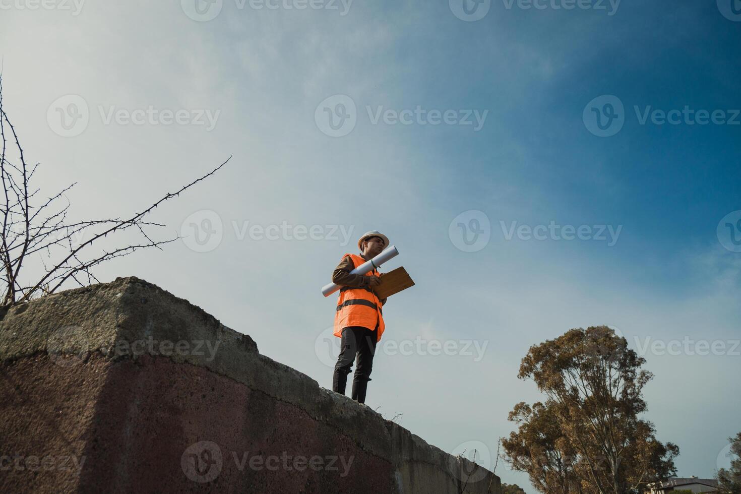 Architect Taking A Look At The Big Project Map Outdoor In The Site photo