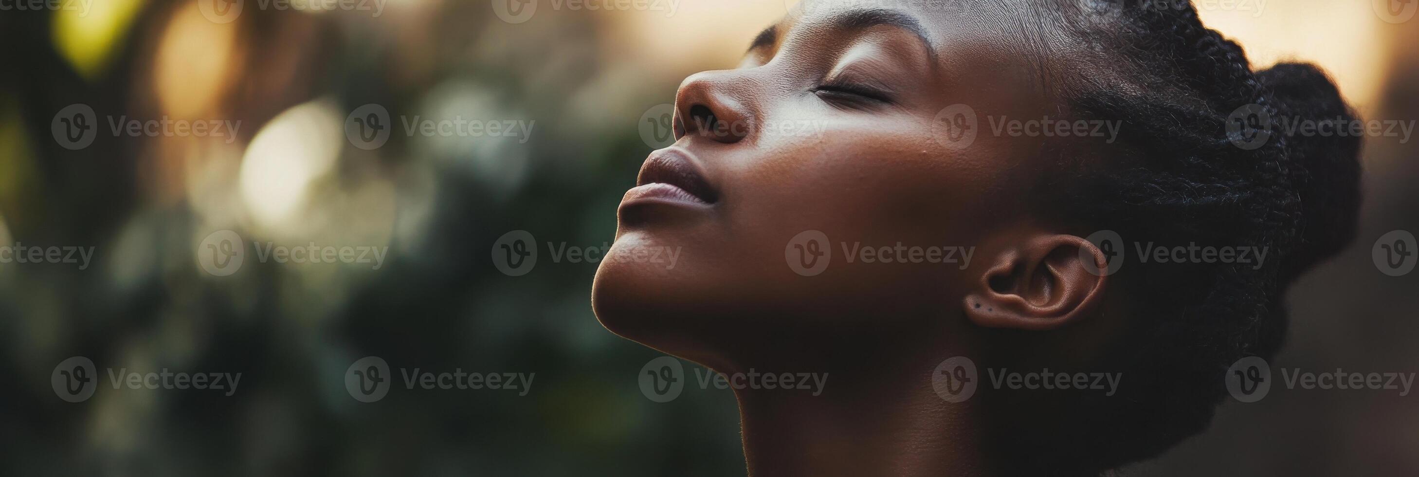 Mother cultivates patience by taking a deep breath in a serene outdoor environment photo