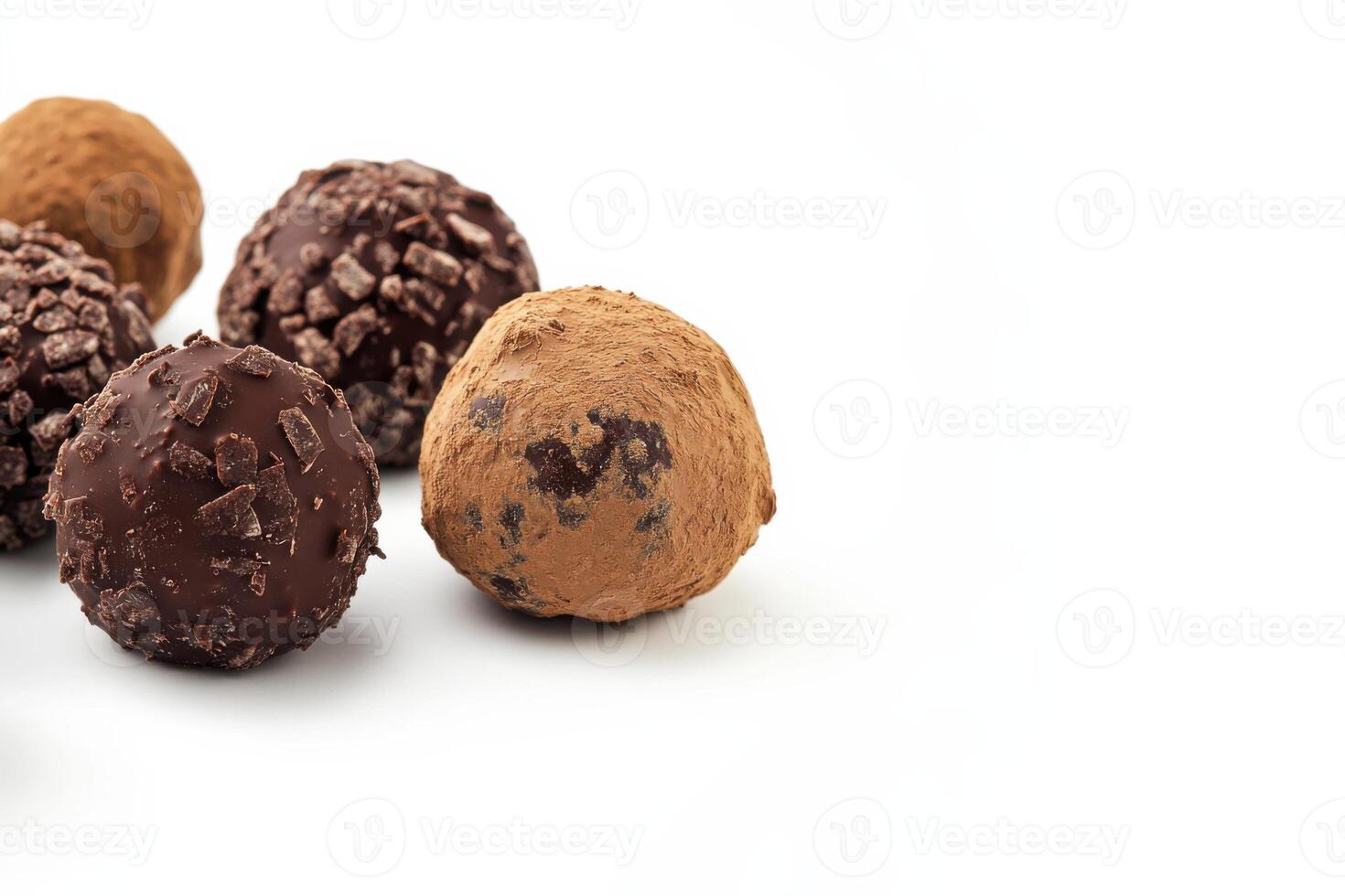 Heart-shaped chocolate truffles beautifully arranged for a romantic celebration on a clean white background, perfect for Valentines Day photo