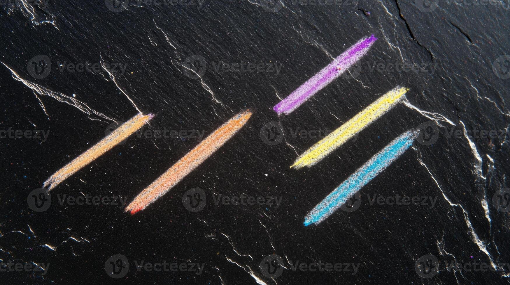 A chalkboard with a chalk drawing of a rainbow photo