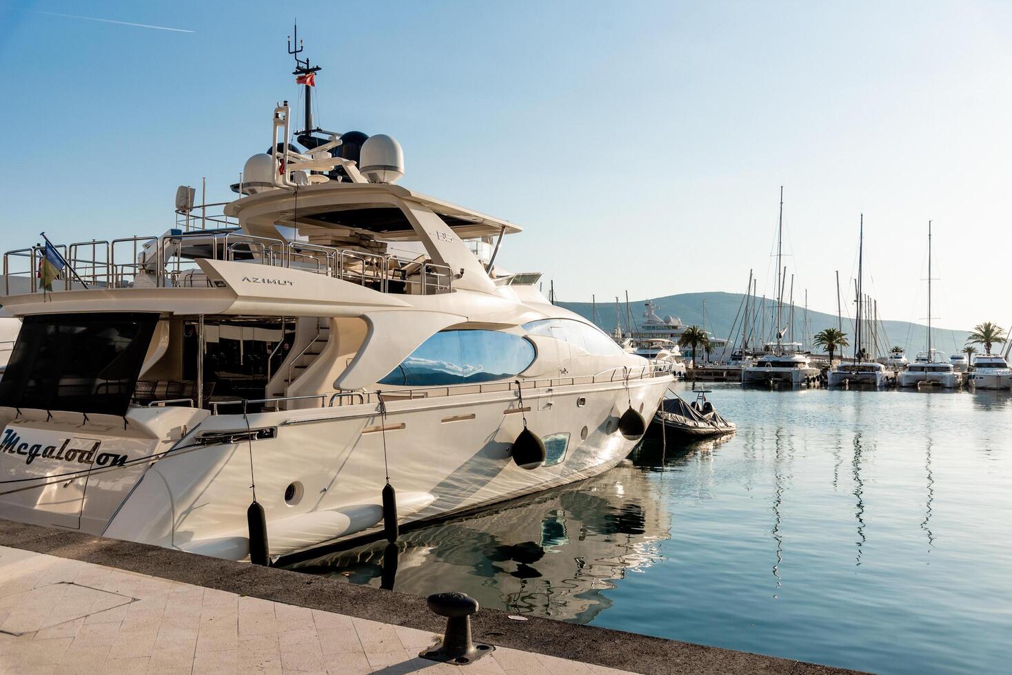 Tivat, Montenegro, 27 April 2025, yachts outdoor are parked in harbor Porto Montenegro photo
