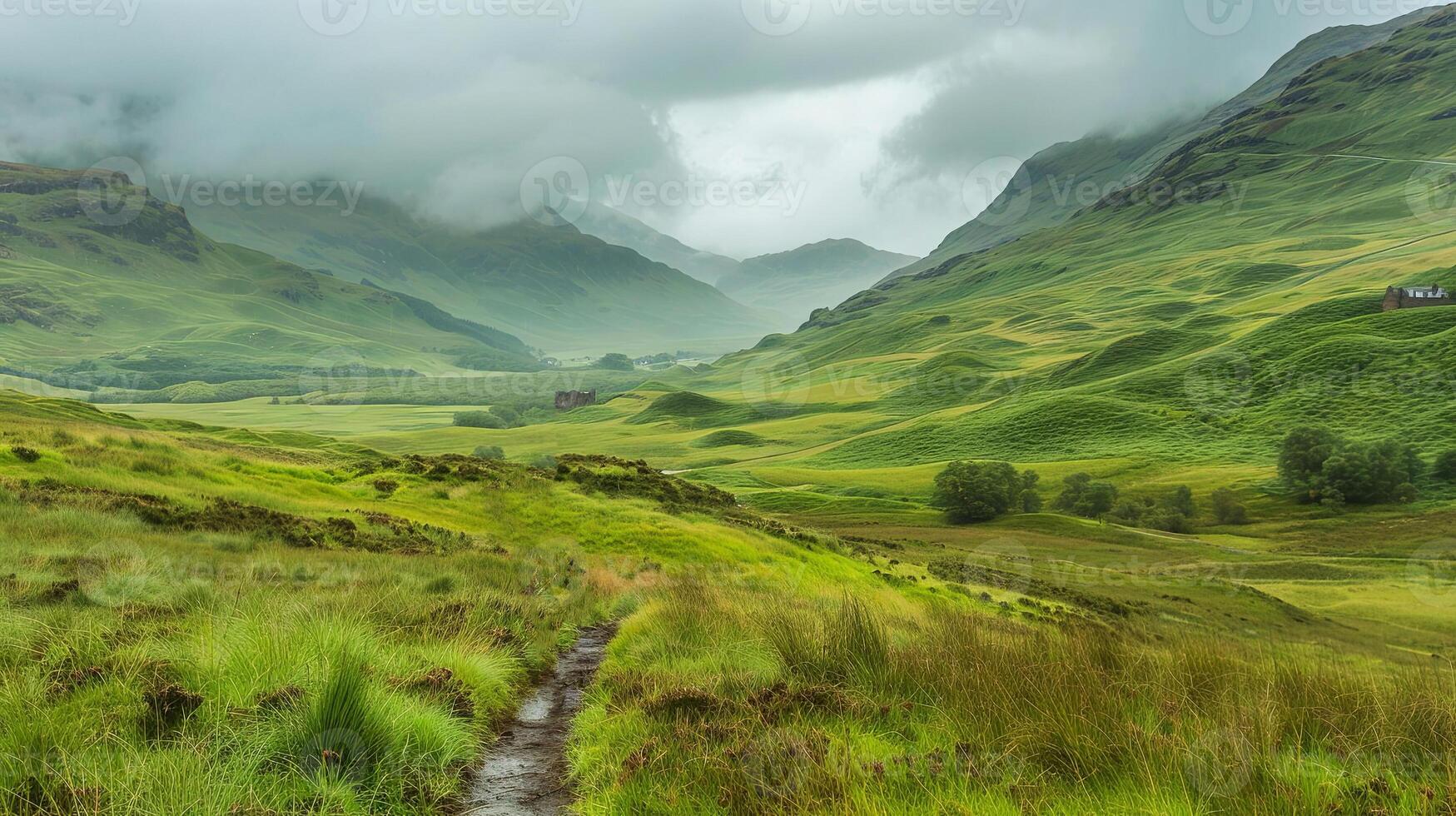 Lush green valley landscape with rolling hills and misty mountains in the background, showcasing the beauty of nature and serene outdoor environment photo