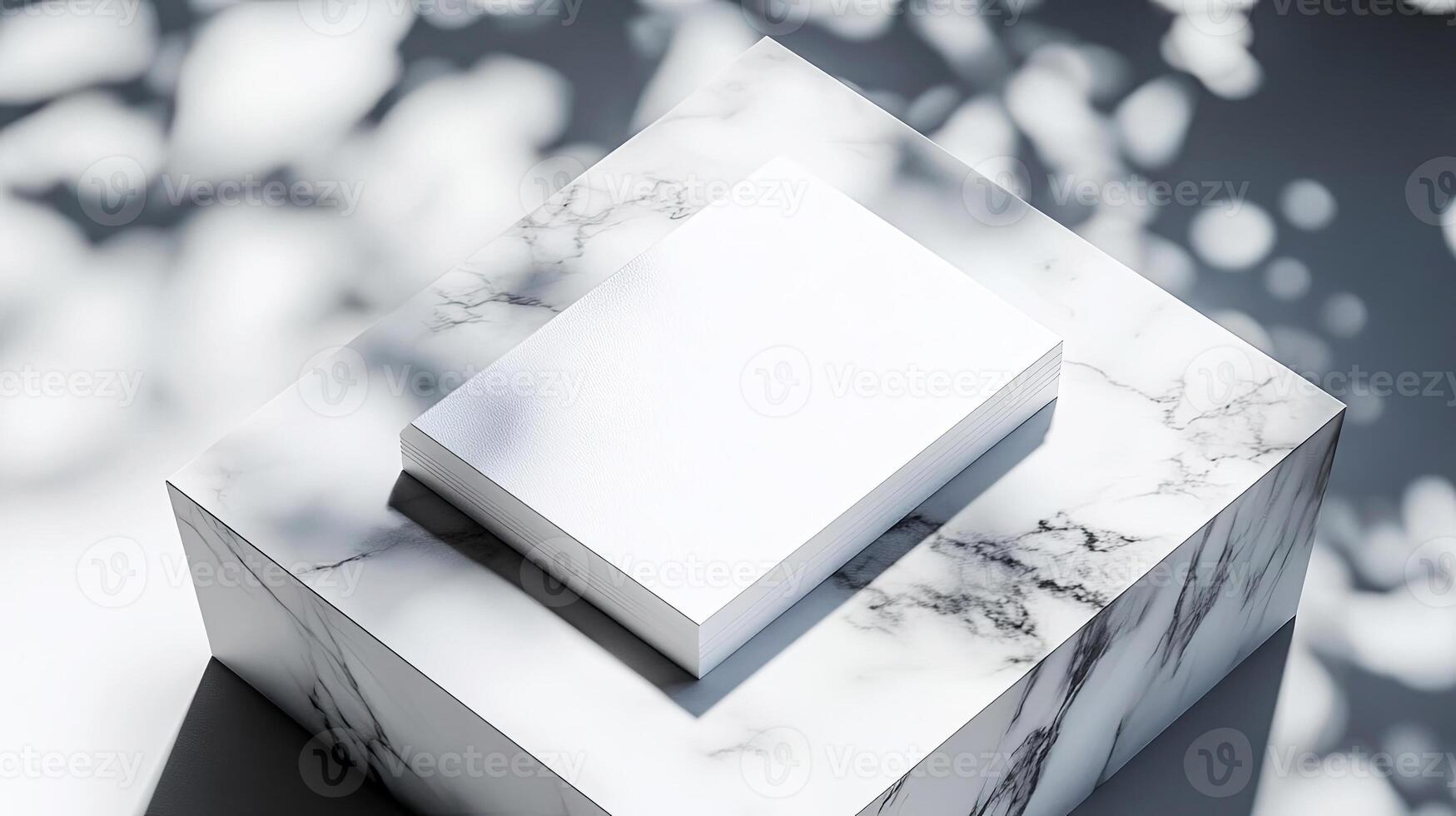 A white square box sitting on top of a marble surface photo