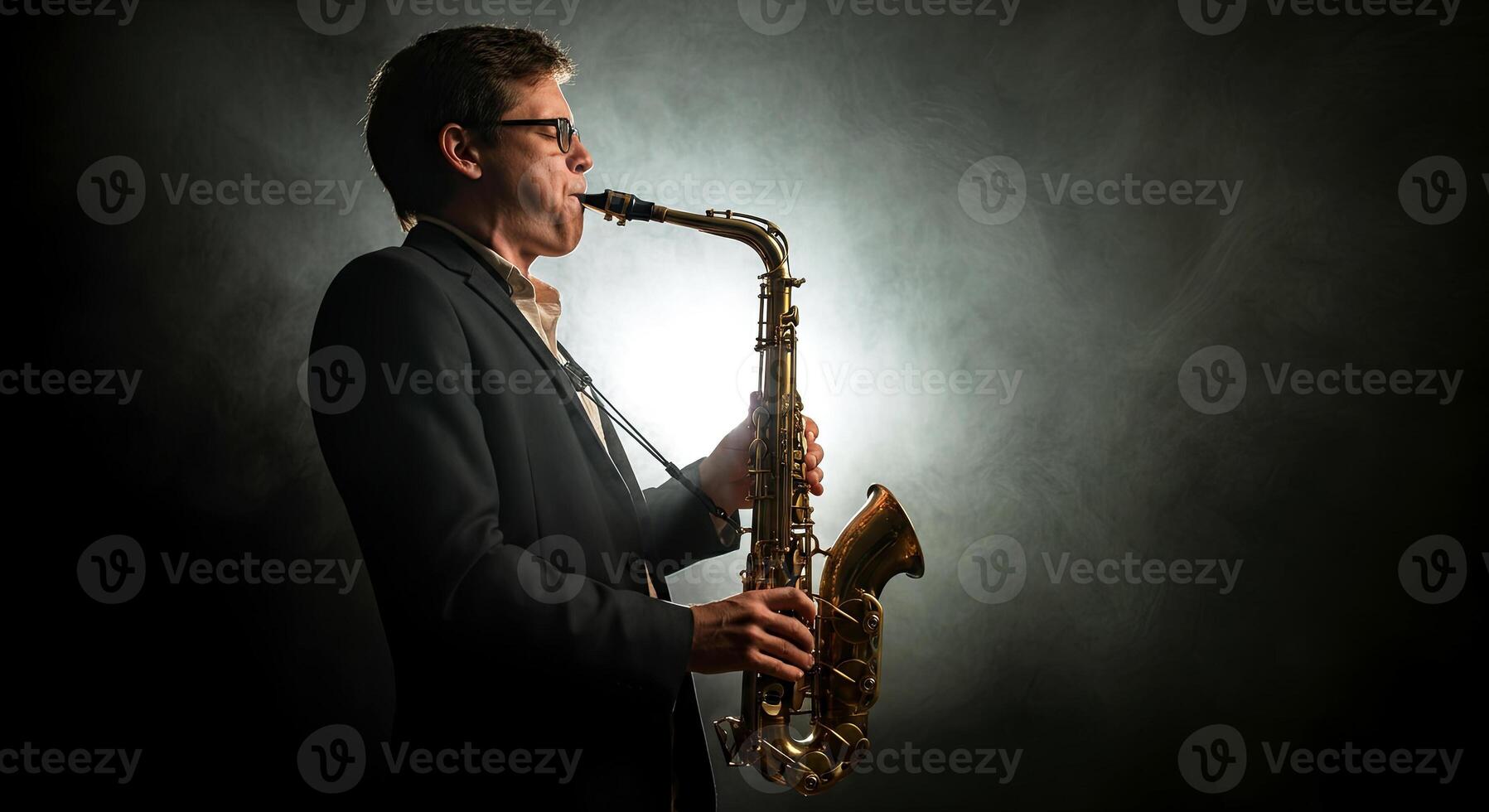 A man in a suit is playing the saxophone photo