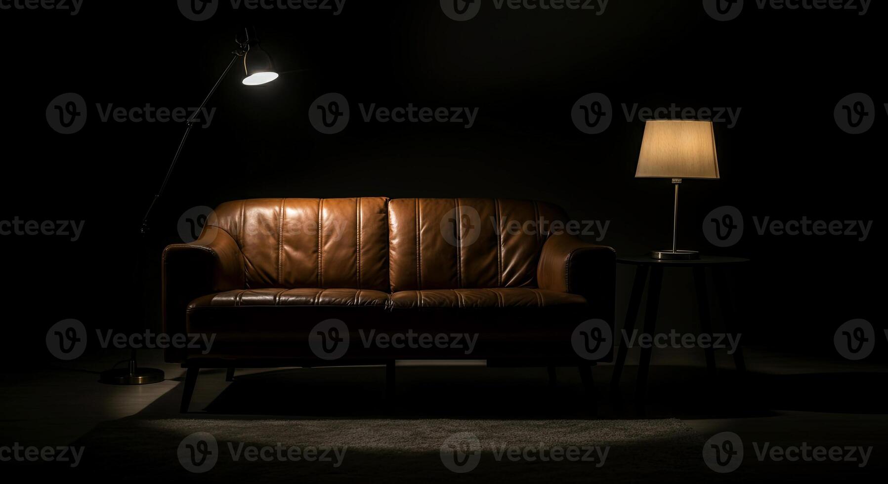 Elegant brown leather sofa illuminated by soft light from a nearby lamp, creating a cozy atmosphere in a darkened room with minimalistic decor and inviting ambiance photo