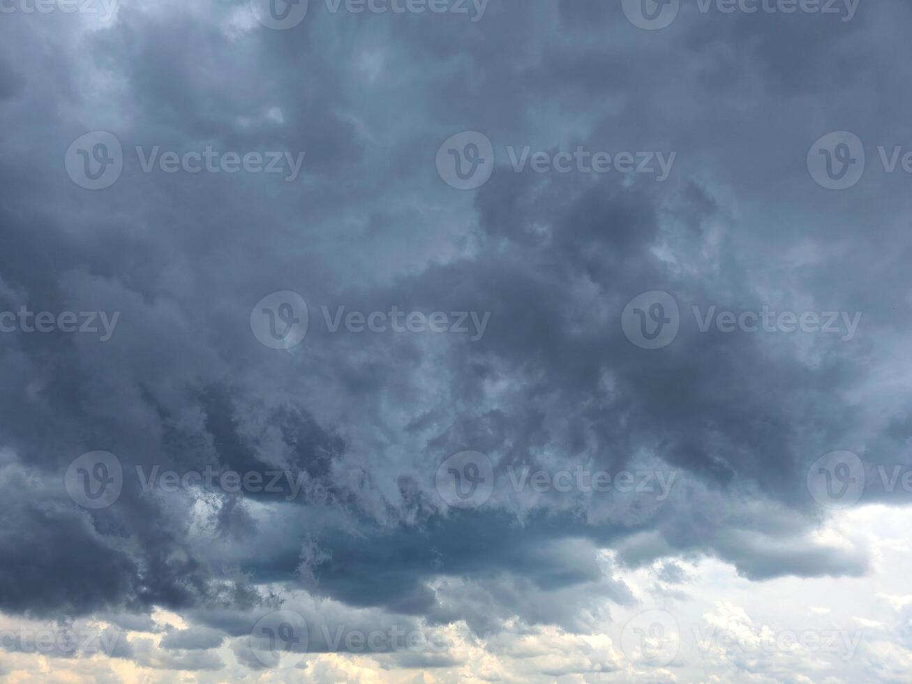 Dramatic Storm sky with dark blue and grey cumulus. Rainy clouds background texture. Just before the heavy rain or thunderstorm. dramatic dark clouds in the sky. Beautiful landscape photo