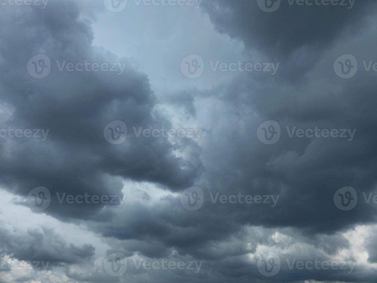 Dramatic Storm sky with dark blue and grey cumulus. Rainy clouds background texture. Just before the heavy rain or thunderstorm. dramatic dark clouds in the sky. photo