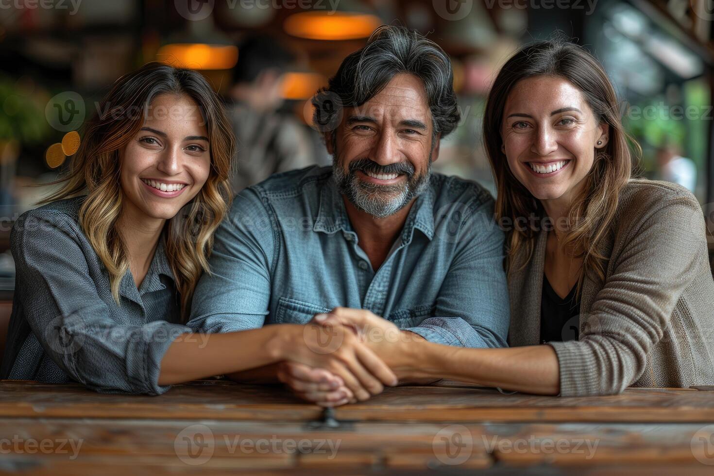 Happy family smiling together at a table photo