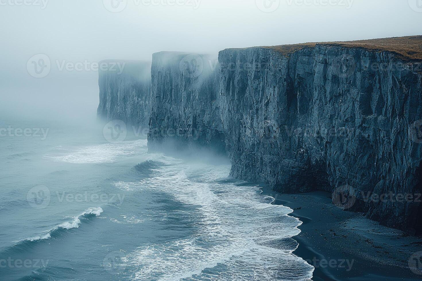 Dramatic Coastal Cliffs Enveloped in Mist and Waves photo
