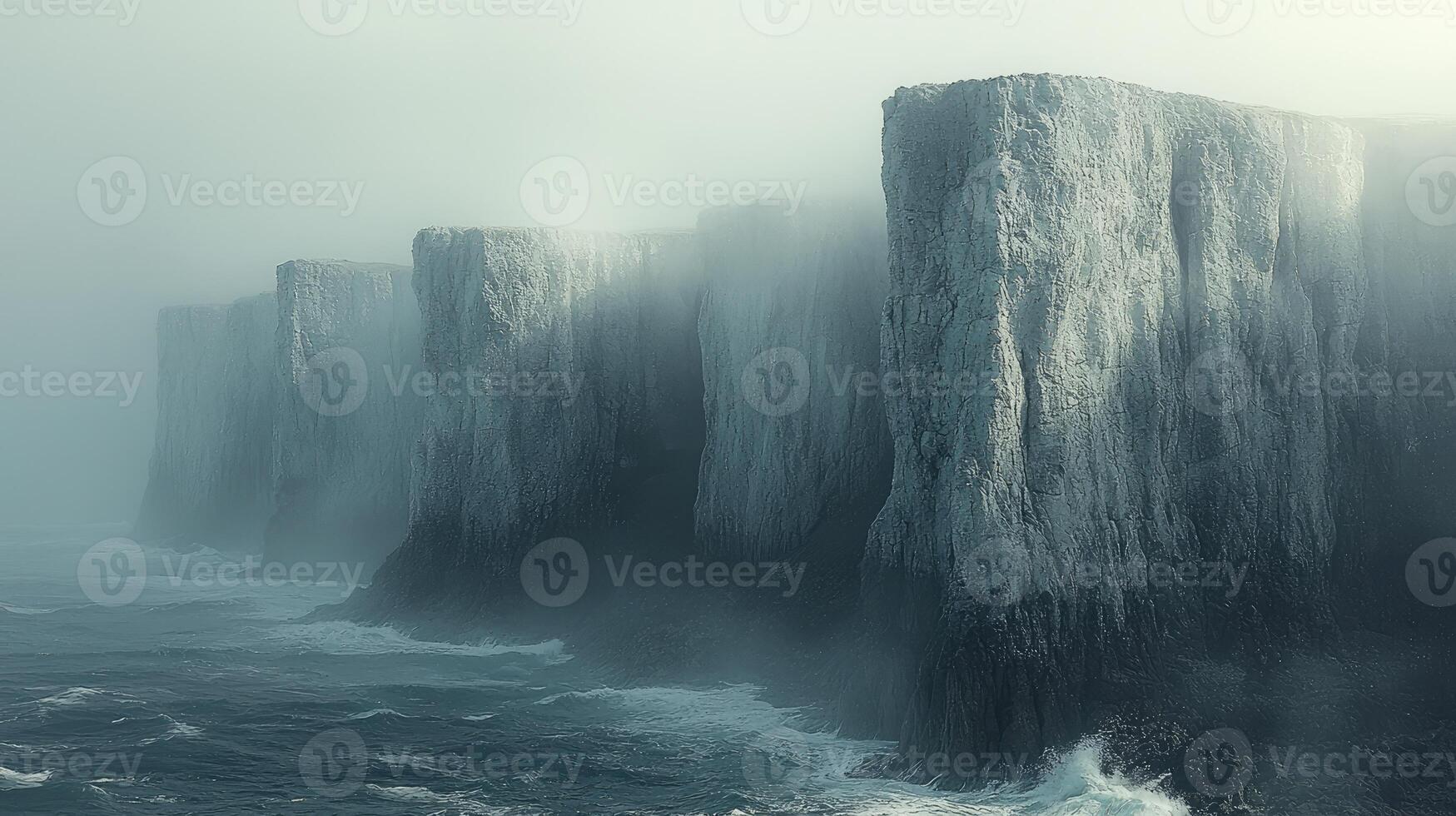 Majestic Cliffs Enveloped In Misty Ocean Fog photo