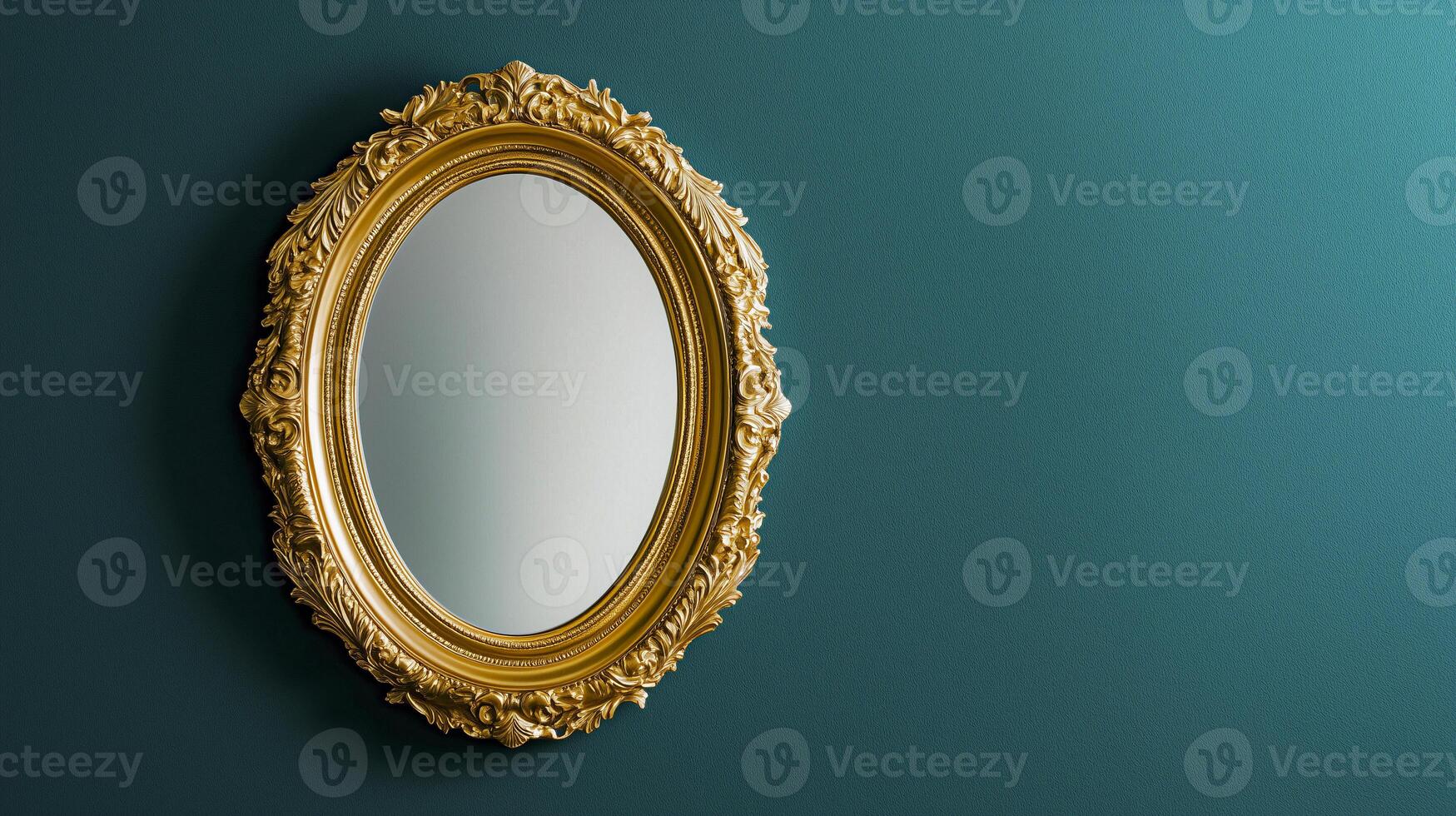 Golden oval mirror on blue wall photo