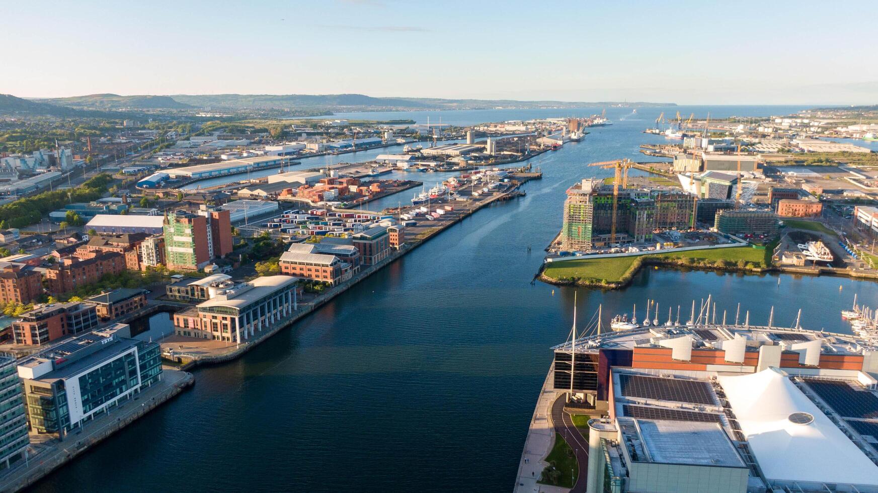 4.5.25 Belfast, UK Aerial view on Lagan River and buildings in City centre of Belfast Northern Ireland. Drone photo, high angle view Harland and Wolff Shipyard and Docks photo