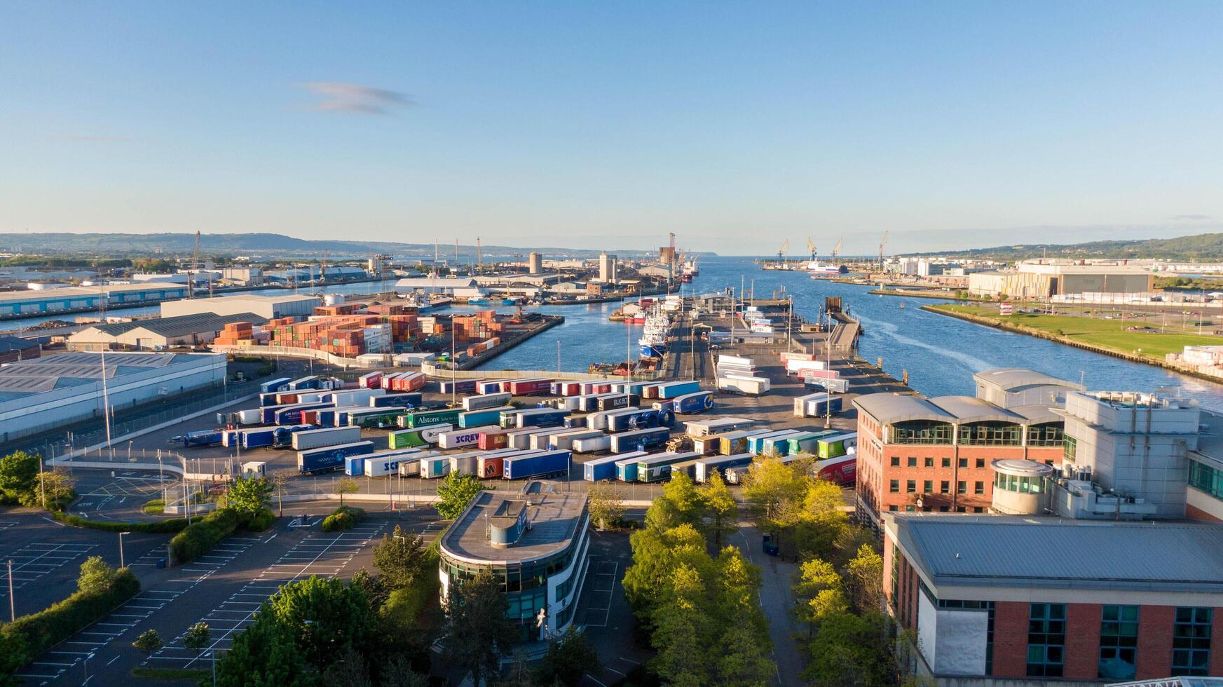4.5.25 Belfast, UK Aerial view on Lagan River and buildings in City centre of Belfast Northern Ireland. Drone photo. Harland and Wolff Shipyard and Docks. photo