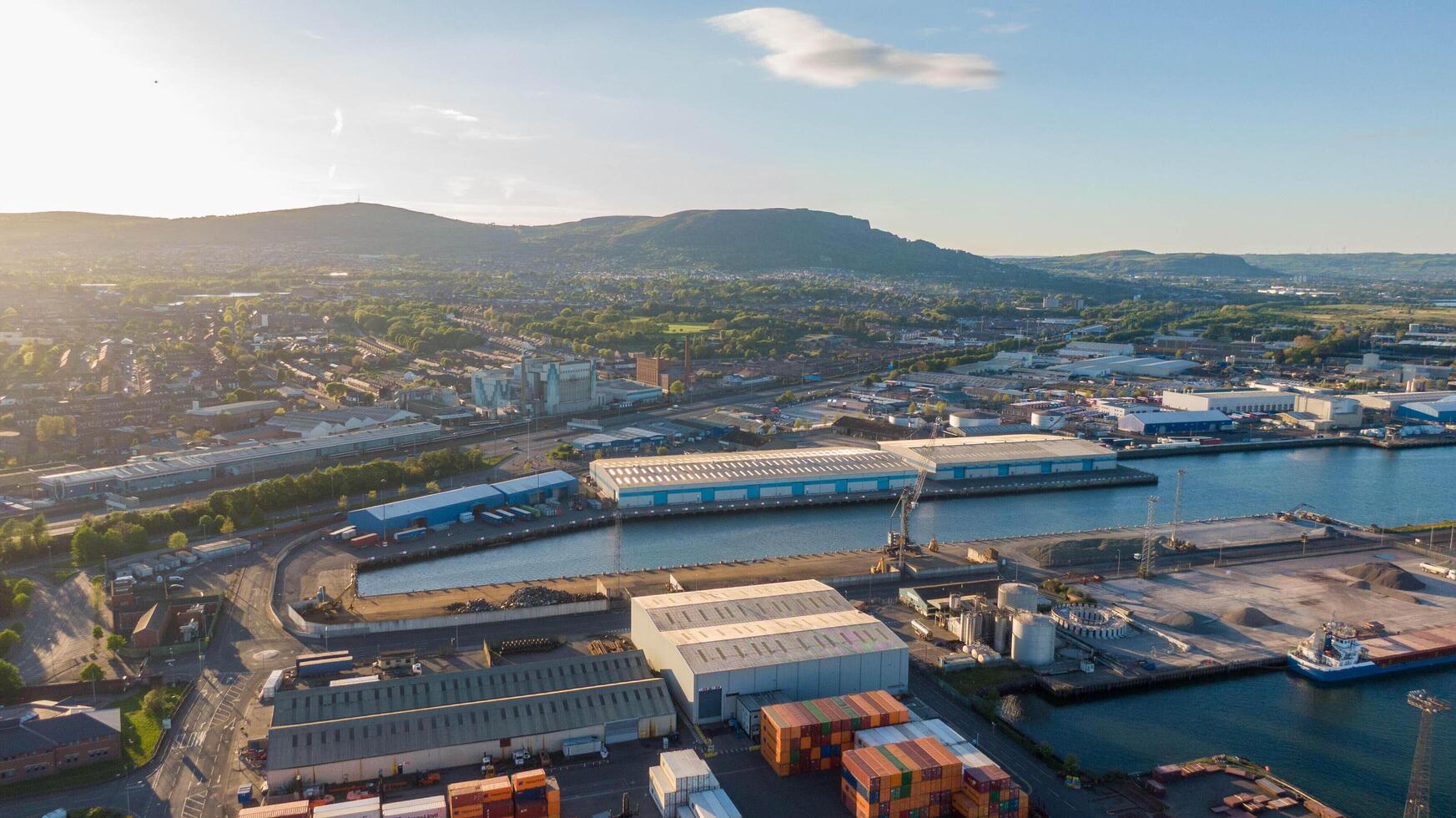 4.5.25 Belfast UK Aerial view on Lagan River and buildings in City centre of Belfast Northern Ireland. Drone photo, high angle view of town. Harland and Wolff Shipyard and Docks photo
