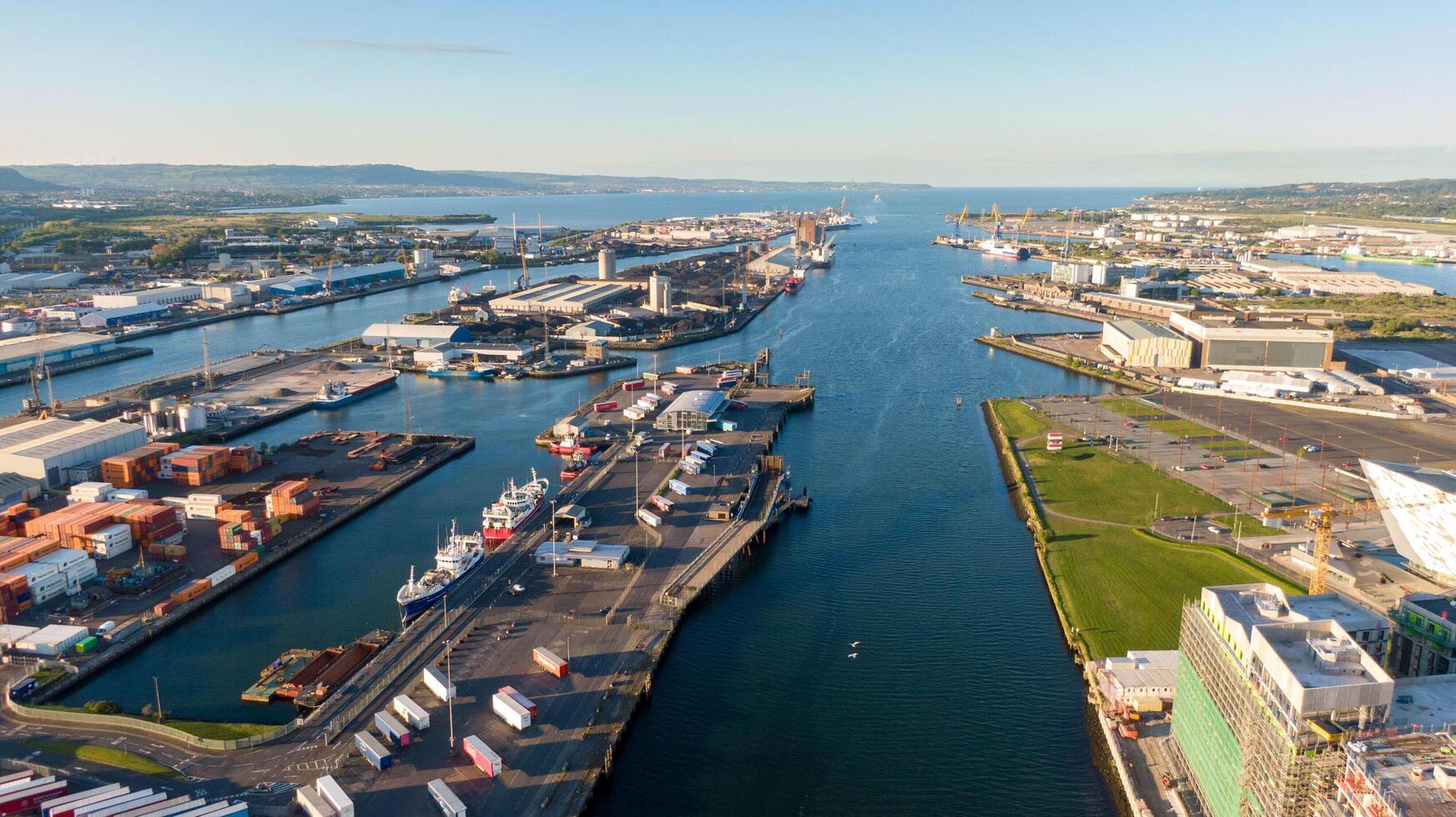 4.5.25 Belfast, UK Aerial view on Lagan River and buildings in City centre of Belfast Northern Ireland. Drone photo, high angle view of town. Harland and Wolff Shipyard and photo