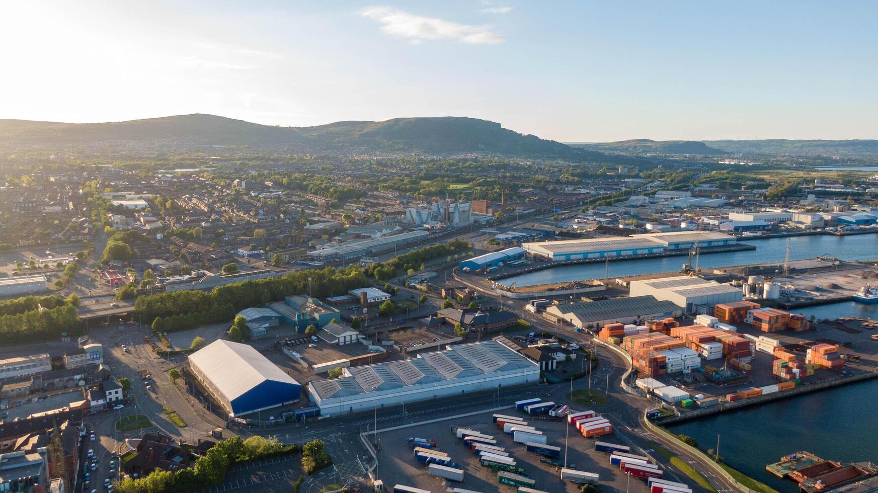 4.5.25 Belfast, UK Aerial view on Lagan River and buildings in City centre of Belfast Northern Ireland. Drone photo, high angle view Harland and Wolff Shipyard and Docks. photo