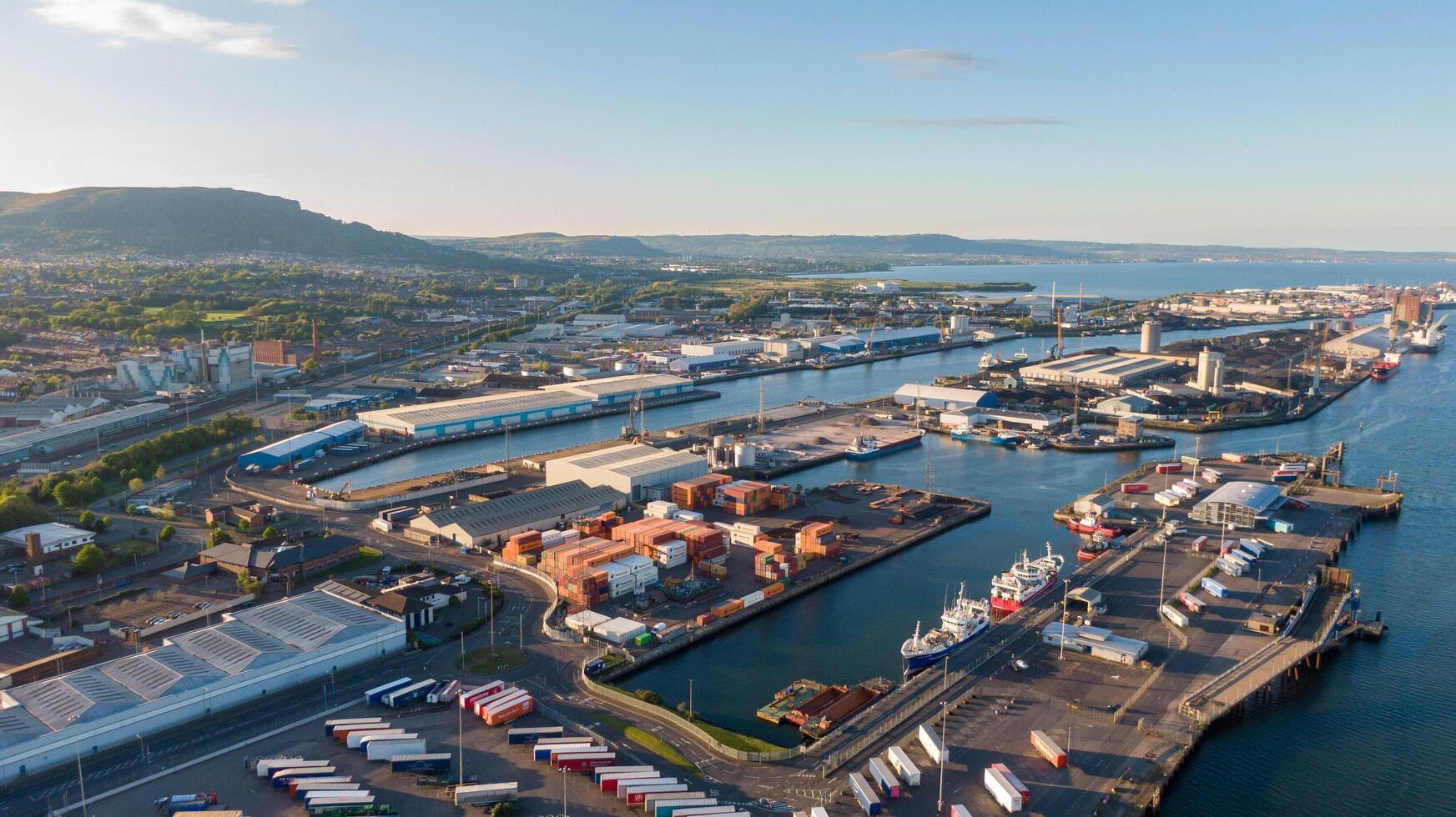4.5.25 Belfast, UK Aerial view on Lagan River and buildings in City centre of Belfast Northern Ireland. Drone photo, high angle view of town. Harland and Wolff Shipyard. photo