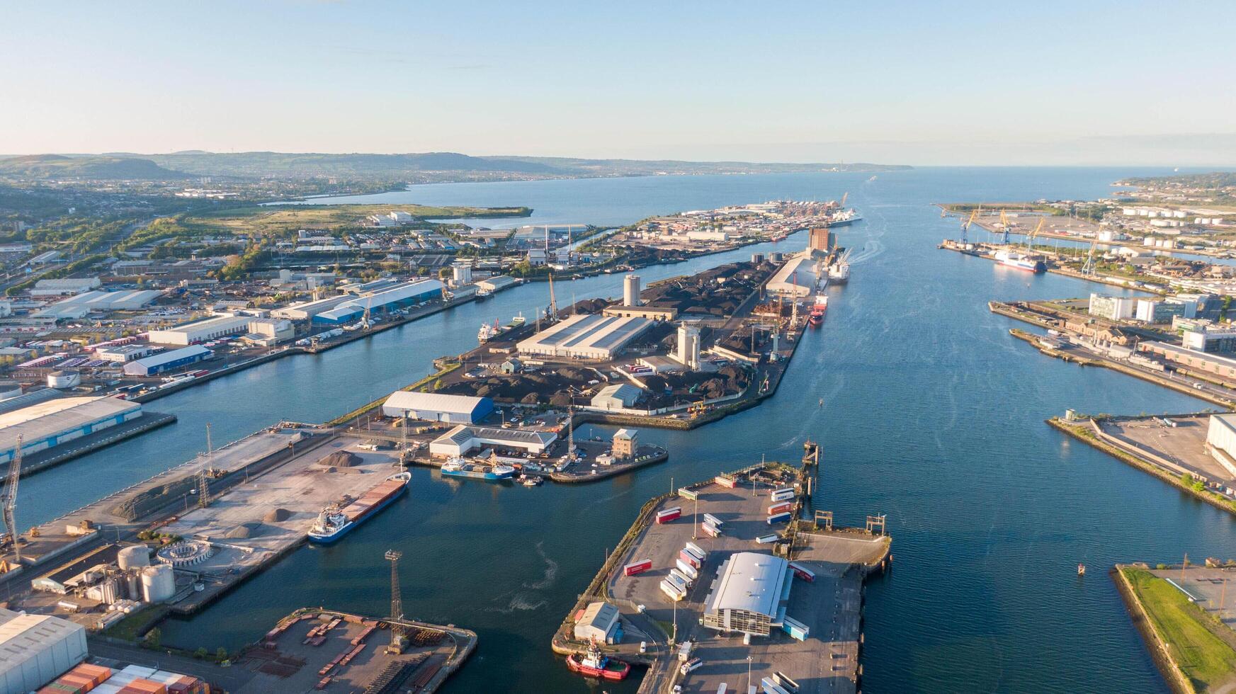4.5.25 Belfast, UK Aerial view on Lagan River and buildings in City centre of Belfast Northern Ireland. Drone photo, high angle of town Harland and Wolff Shipyard and Docks. photo