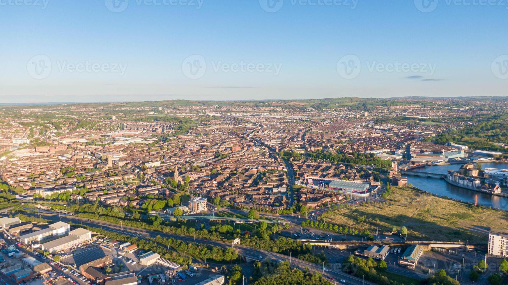 Aerial view on Lagan River and buildings in City centre of Belfast Northern Ireland. Drone high angle view of town photo