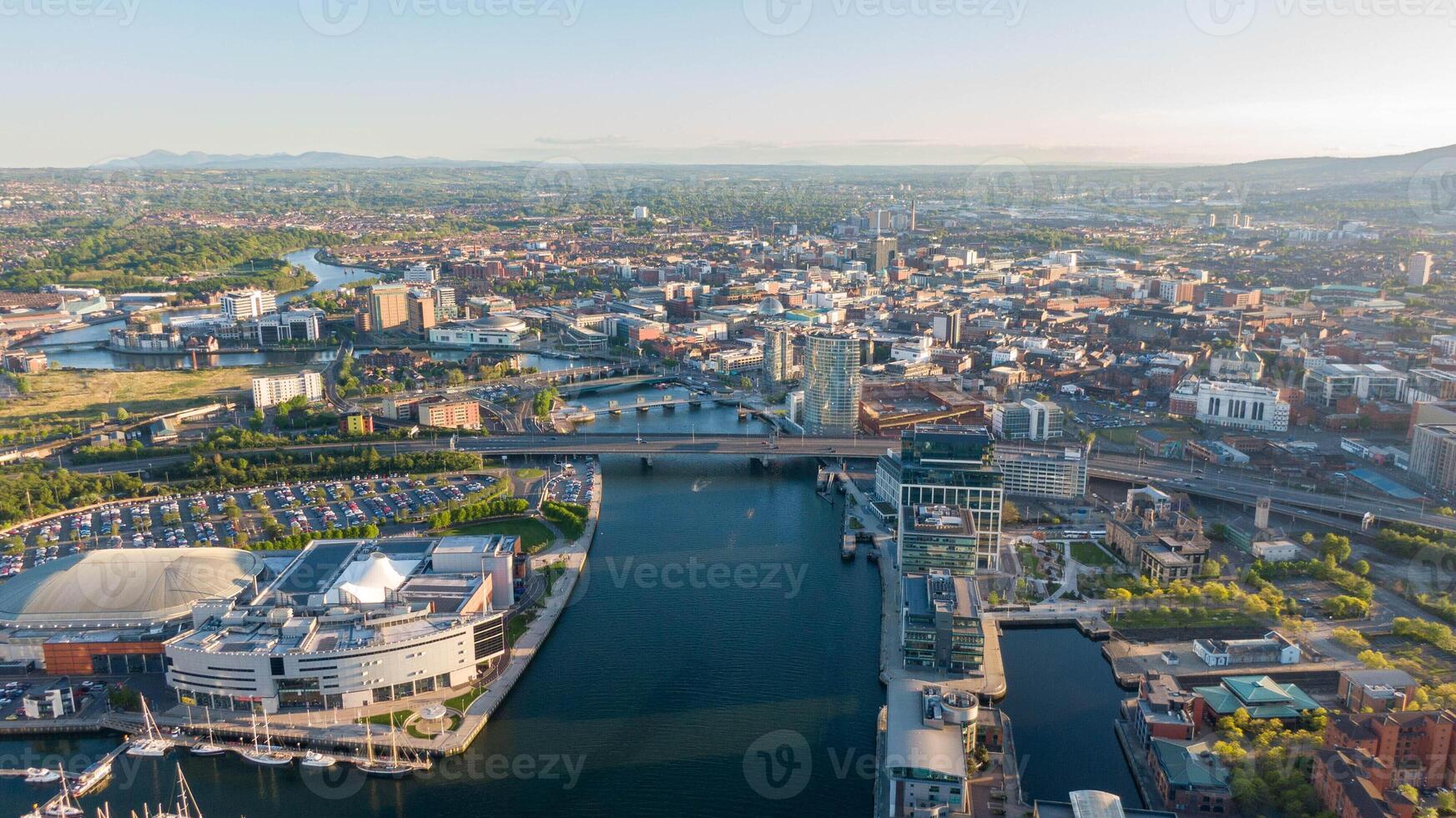 Aerial view on Lagan River and buildings in City centre of Belfast Northern Ireland. Drone photo high angle view of town.