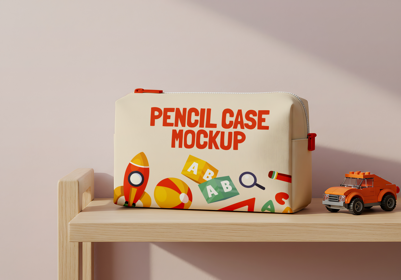 A pencil case mockup featuring a playful design of rockets balls and alphabet blocks sits on a wooden shelf next to a toy car psd