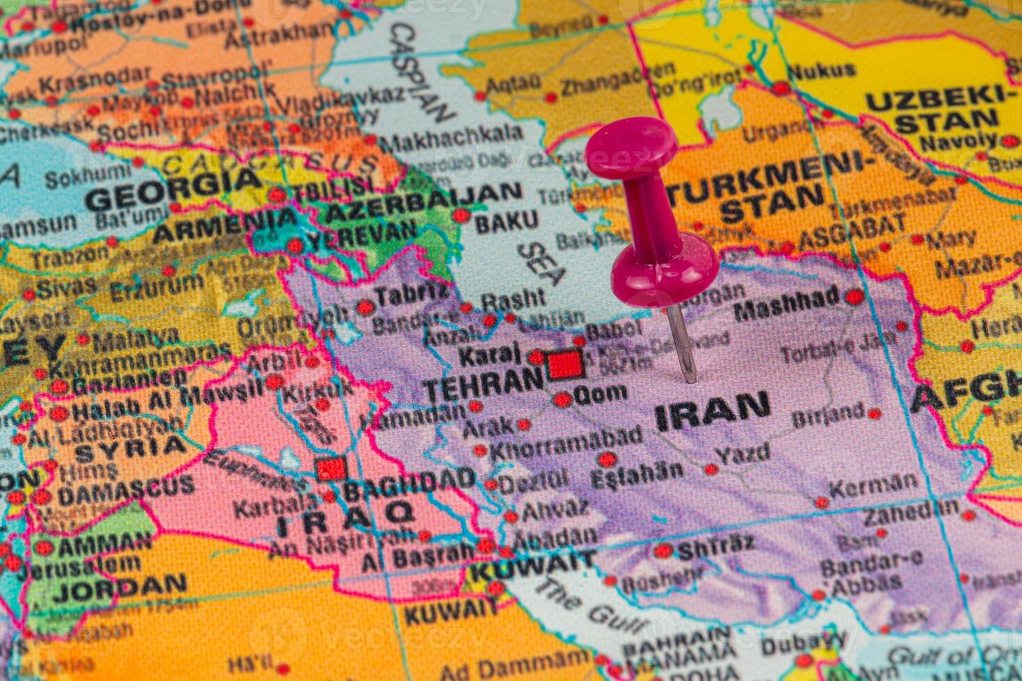 Location pin marks Tehran on a colorful map of Iran photo