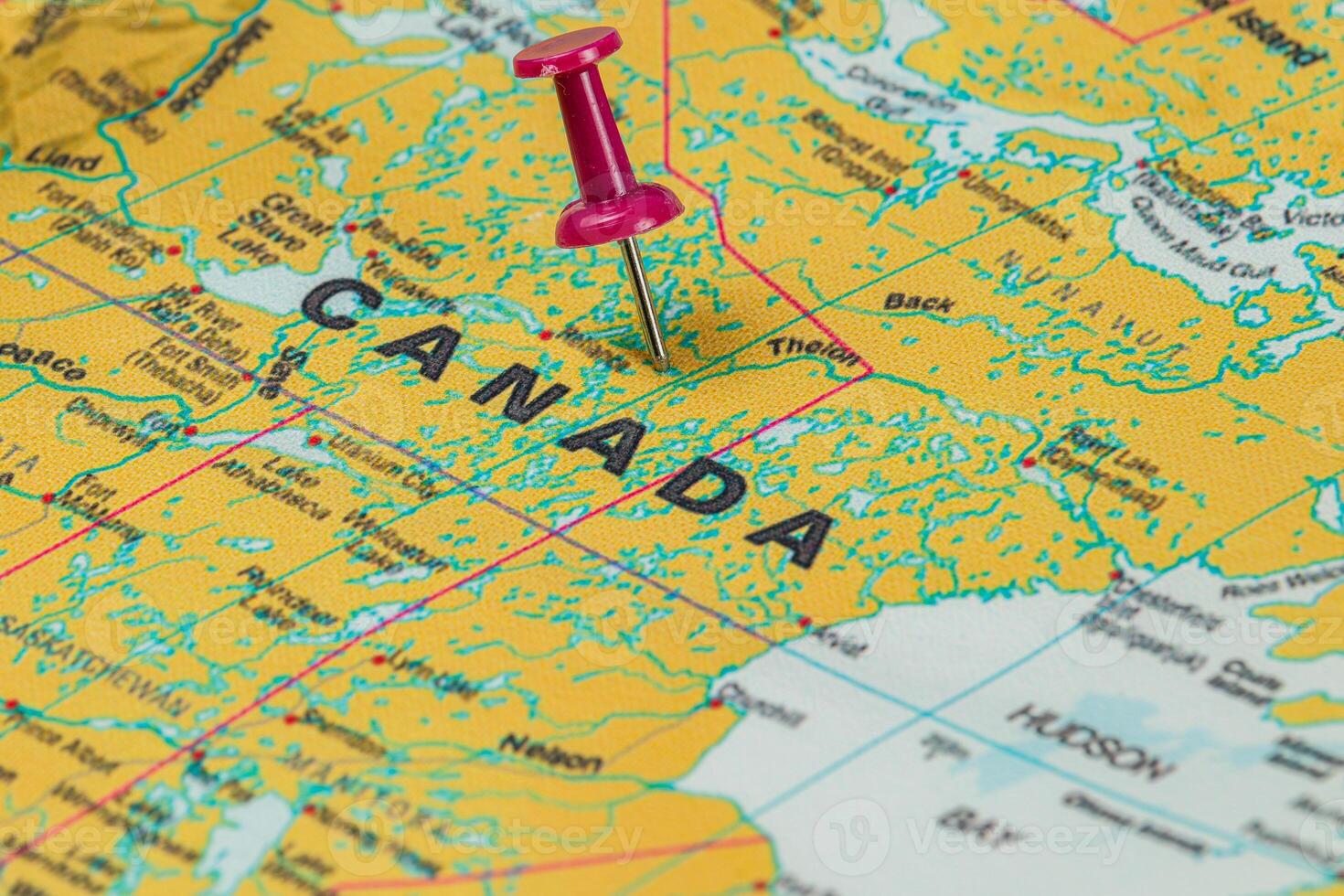 Map of Canada with a pushpin marking a specific location photo