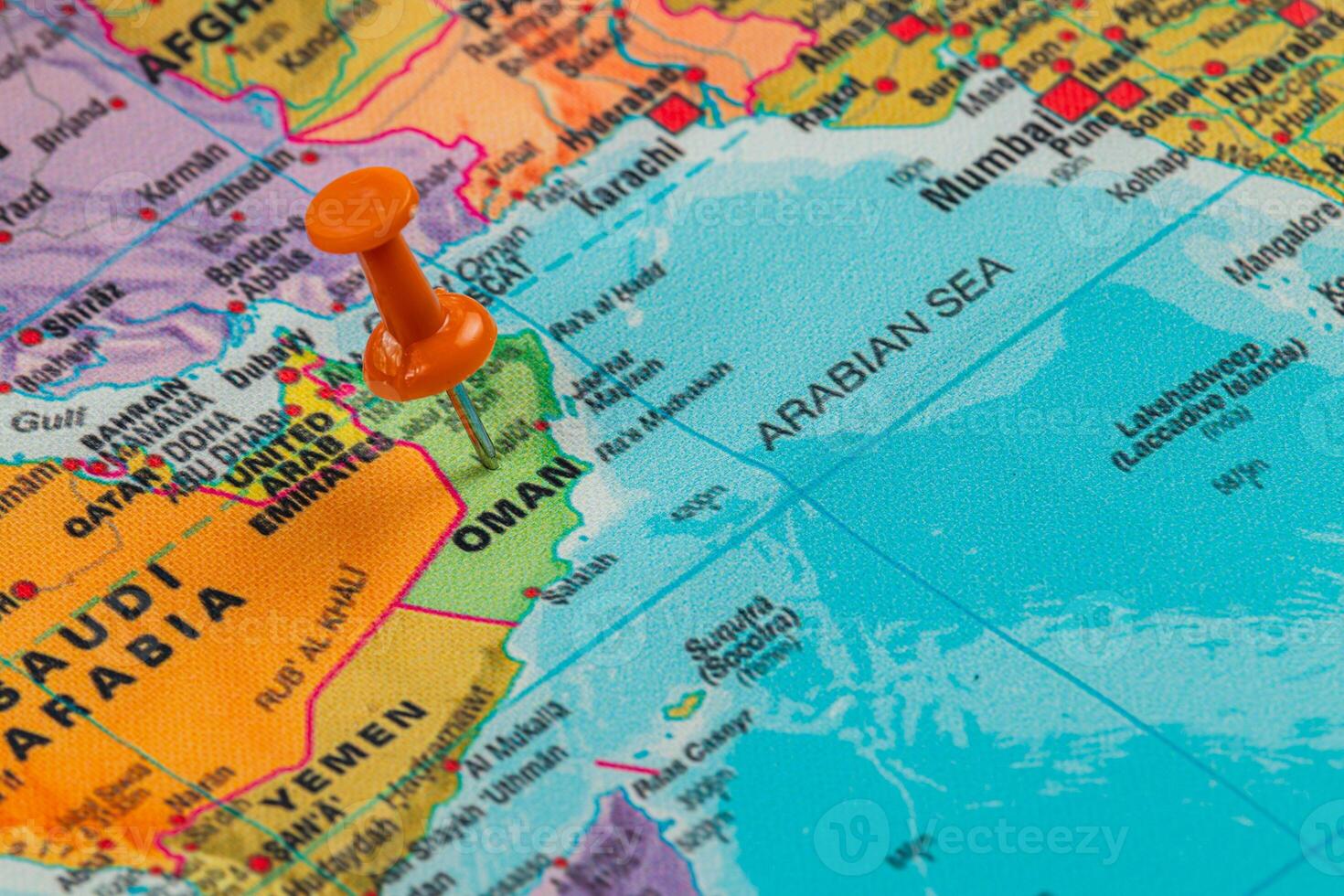Pinpointing Oman on a vibrant world map in detail photo