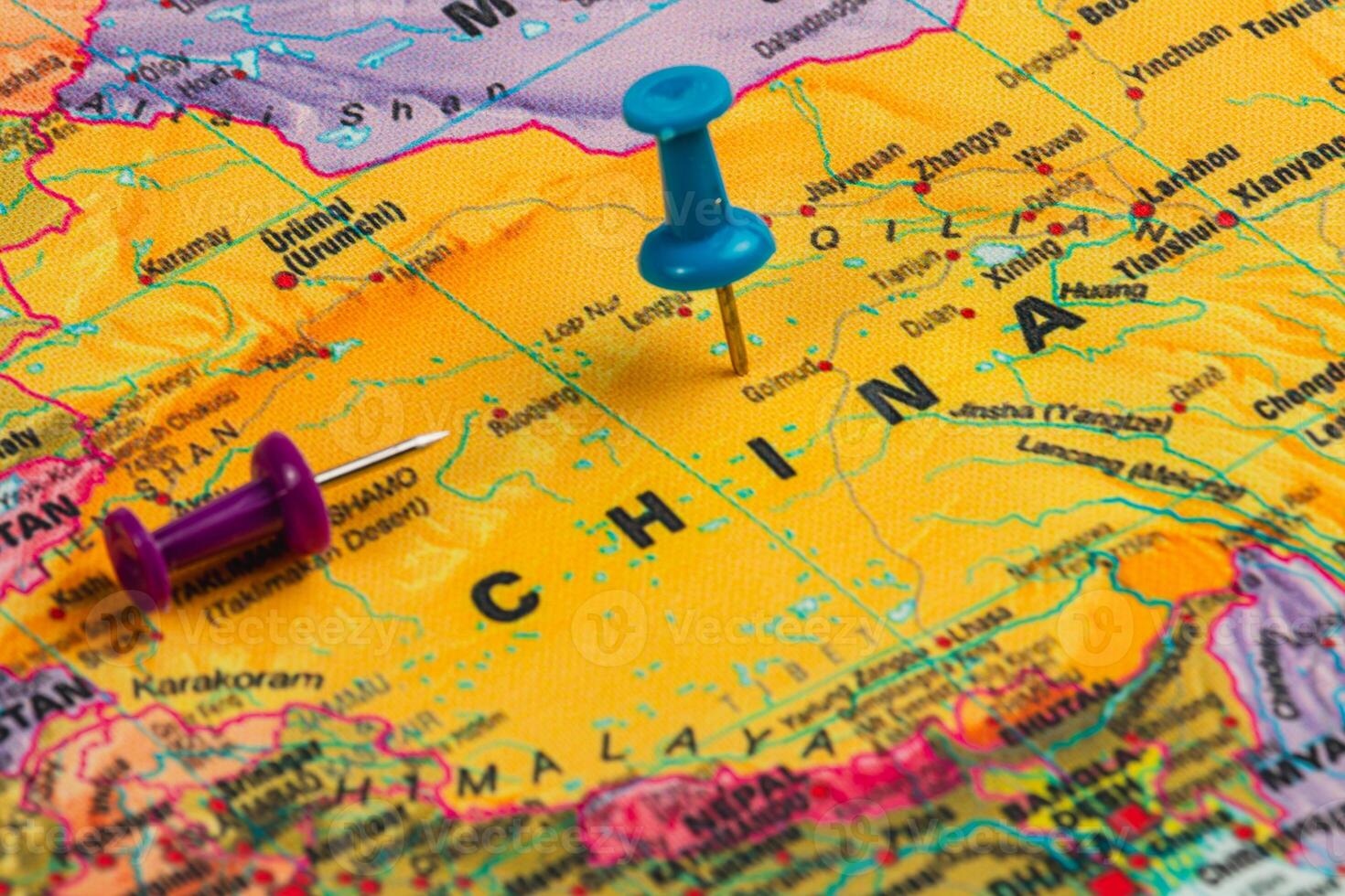 Colorful map of China marked with push pins for travel plans photo