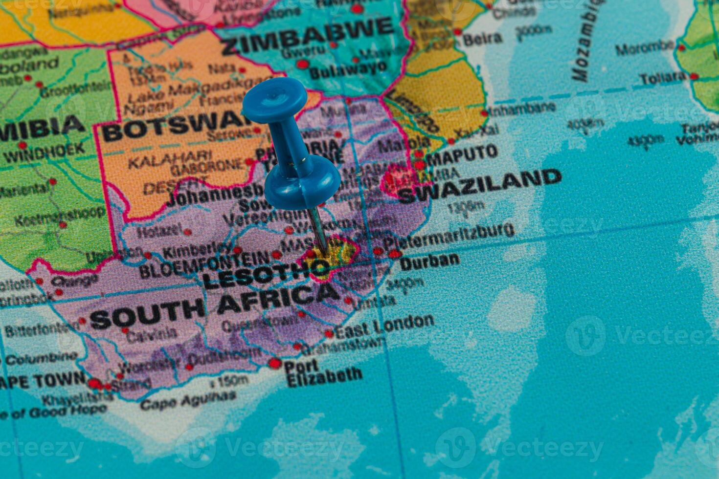 Marker shows Lesotho on a map of southern Africa photo