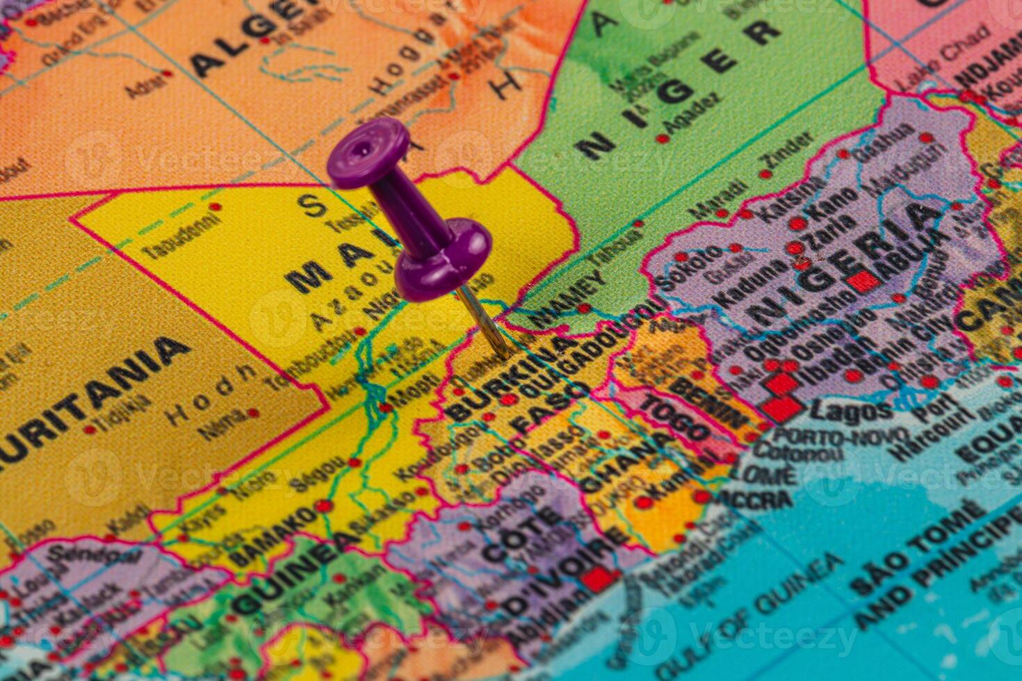 Pin highlighting Burkina Faso on a colorful political map photo