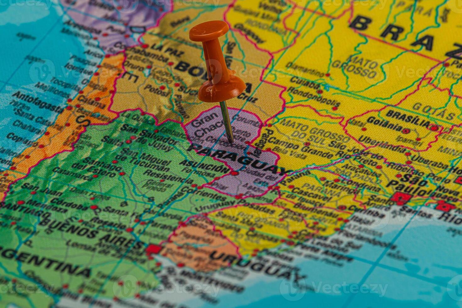Exploring Paraguay on a colorful map with a pin photo